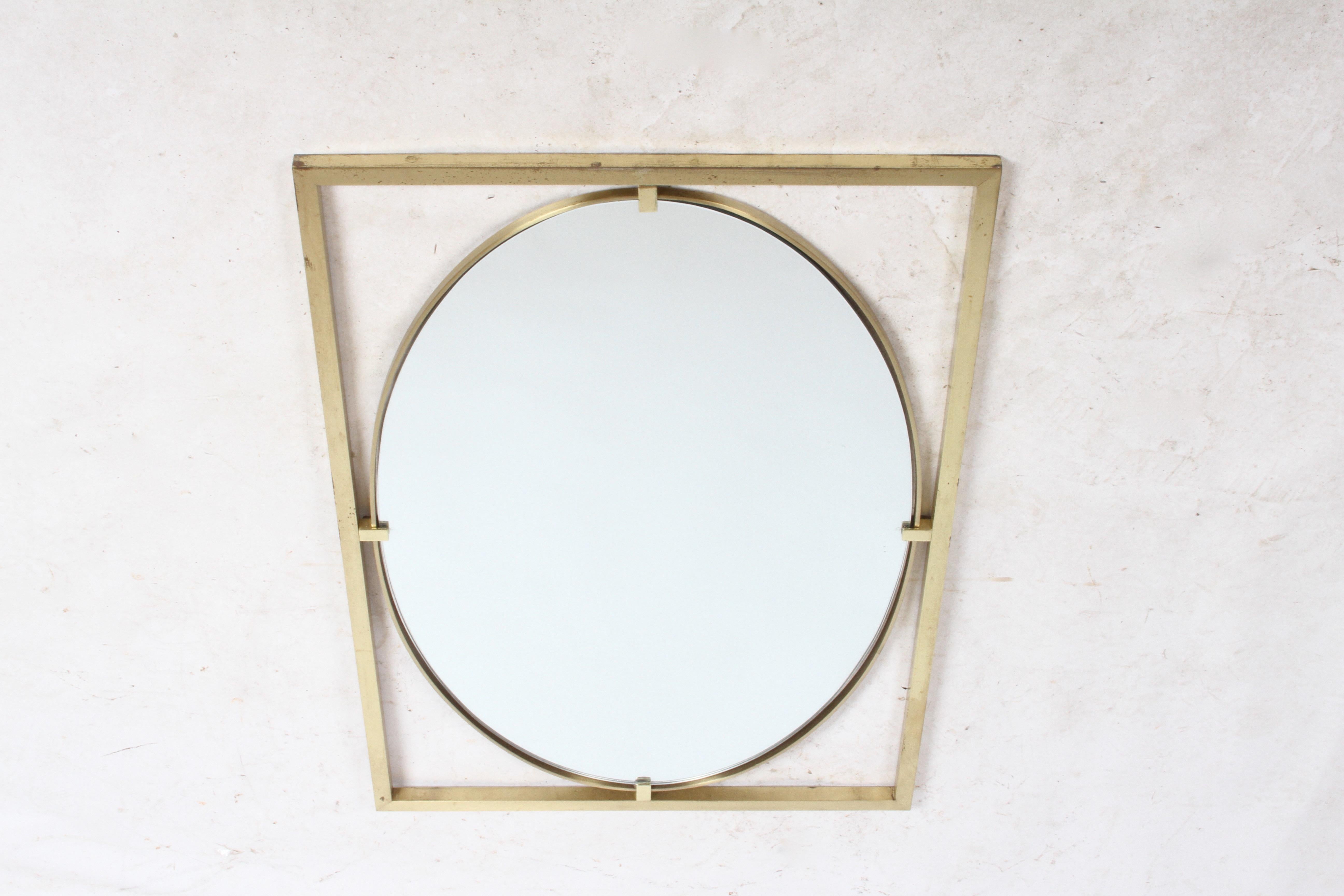 Oval mirror in the Hollywood Regency style by John Widdicomb, circa 1960s. Rectangle brass frame with oval mirror and brass edge. Shown with original patina, can be polished. No label. In the style of Mastercraft.