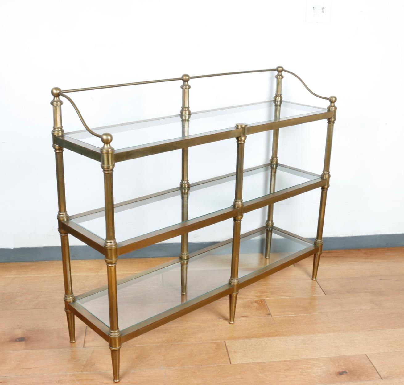 Gorgeous solid heavy brass 3 tier shelve with glass removable shelves. All well kept and sturdy. No broken parts or chips. Great for any entrance or hallway. Solid well made detailed brass.
