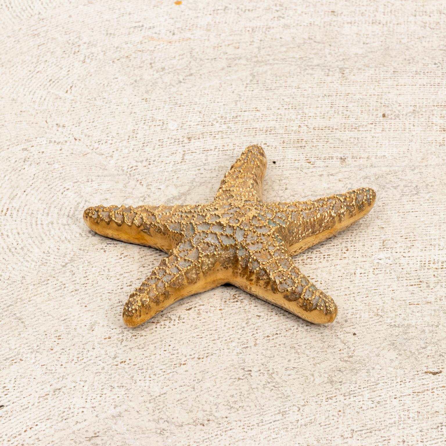 Circa 1960-1970s Hollywood Regency style brass starfish, hand polished and very detailed. Made in the United States. Please note of wear consistent with age.