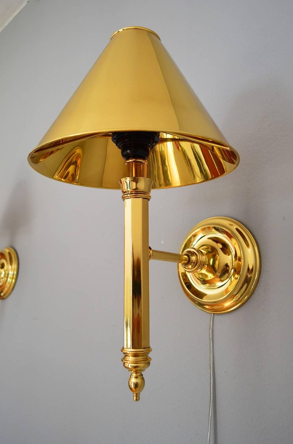 Beautiful set of two wall sconces made completely of brass, also the lamp shades.
Made in Spain, the full Hollywood Regency Style in the 1980s.
Excellent condition with smallest spots on the metal handles, please see all pictures.
For one Edison