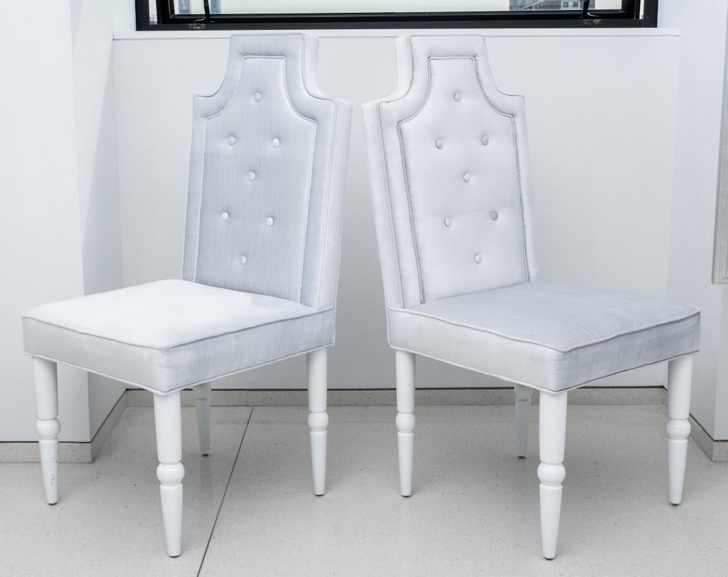 Hollywood Regency set of eight light grey upholstered dining chairs, raised on white painted wood tapered and turned legs. In good condition. Wear consistent with age and use.

Dealer: S138XX.
