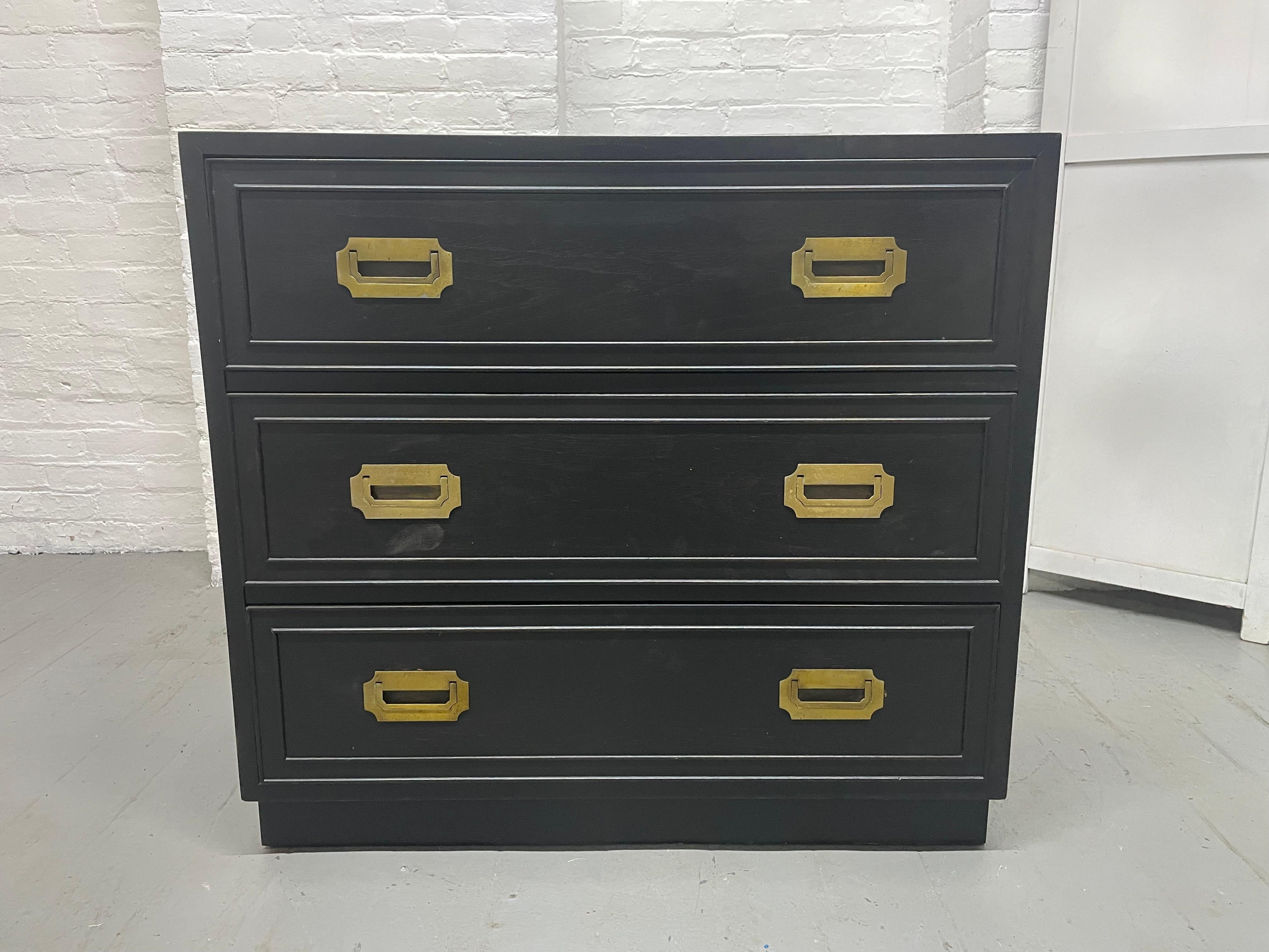 Hollywood Regency Campaign Chest.  The chest is black lacquered with three-pull out drawers and brass hardware.