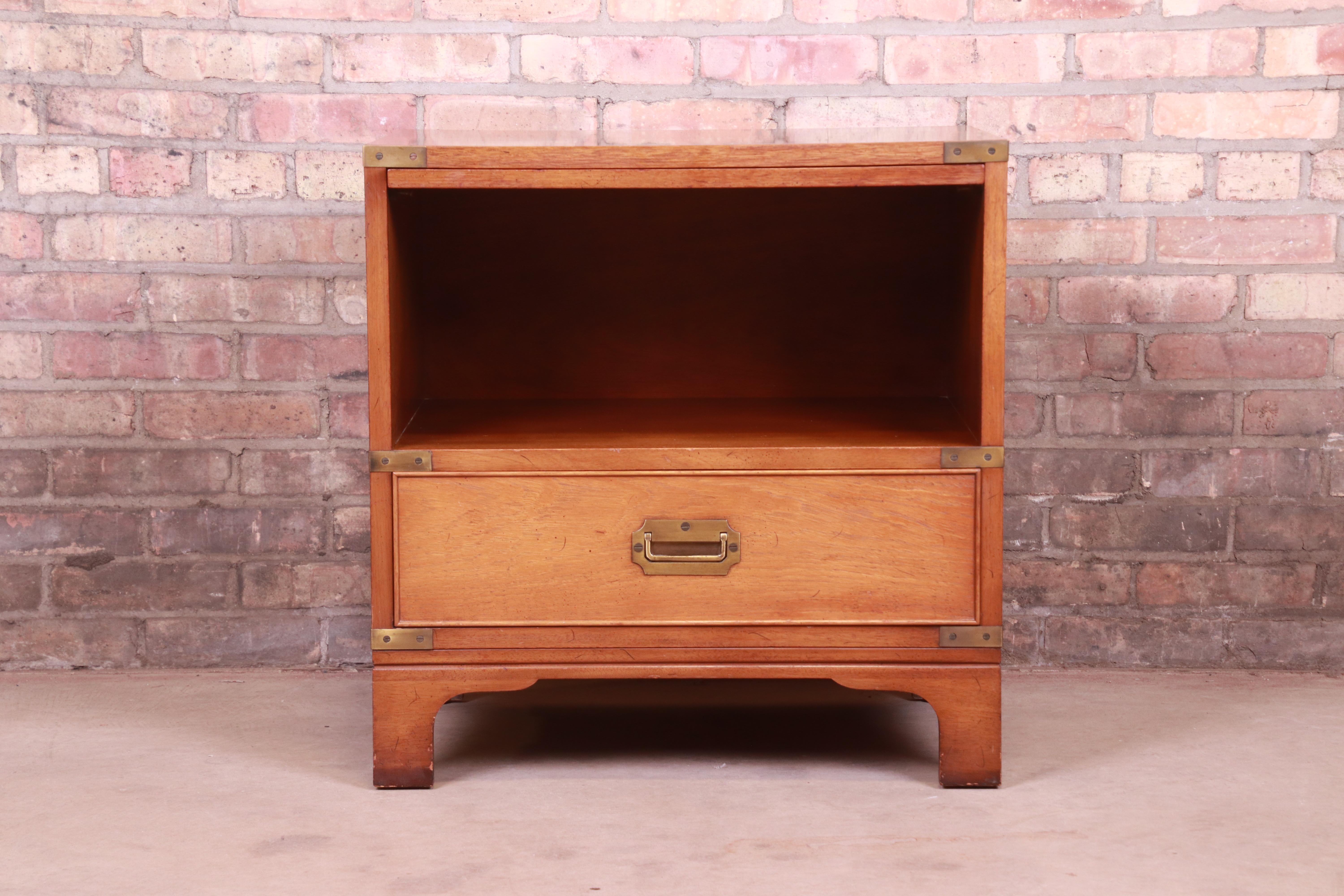 A gorgeous midcentury Hollywood Regency Campaign style nightstand

By Beacon Hill

USA, mid-20th century

Mahogany, with brass hardware and accents.

Measures: 24.88