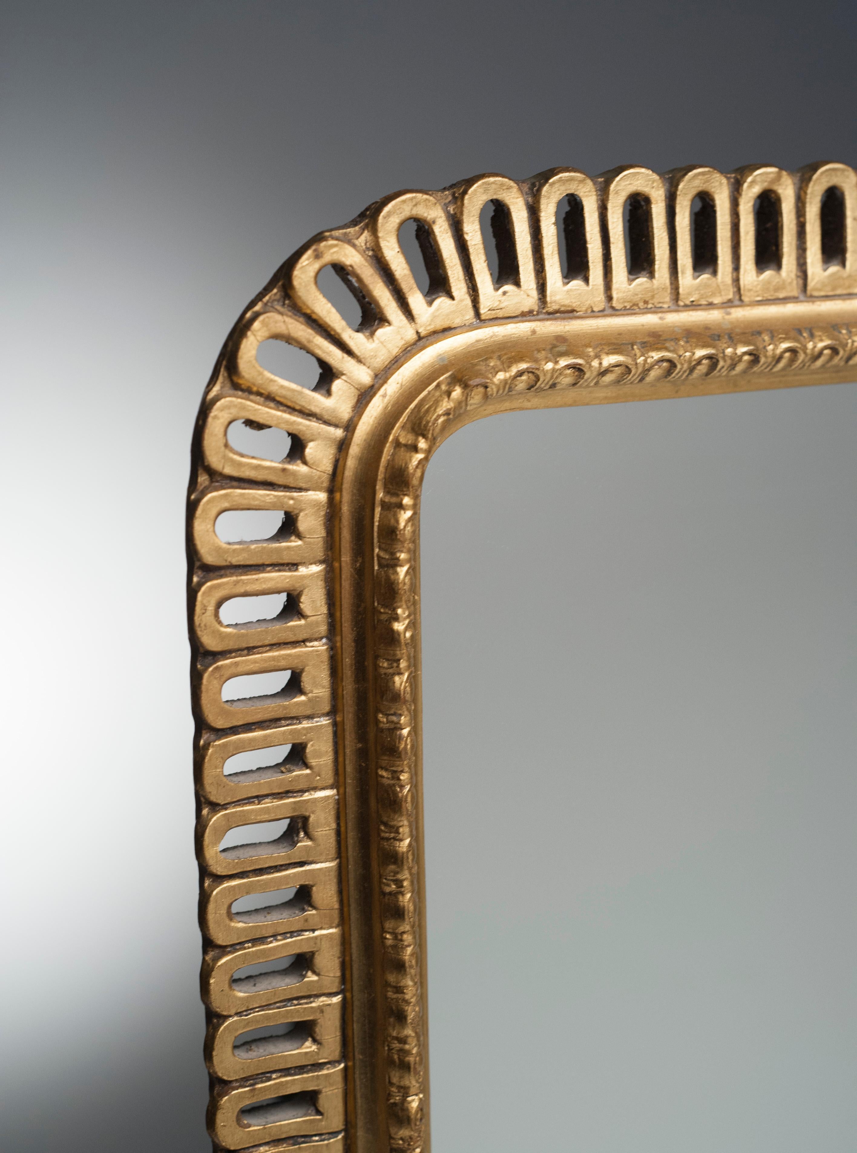 Mid-20th Century Hollywood Regency Carved Giltwood Rectangular Mirror