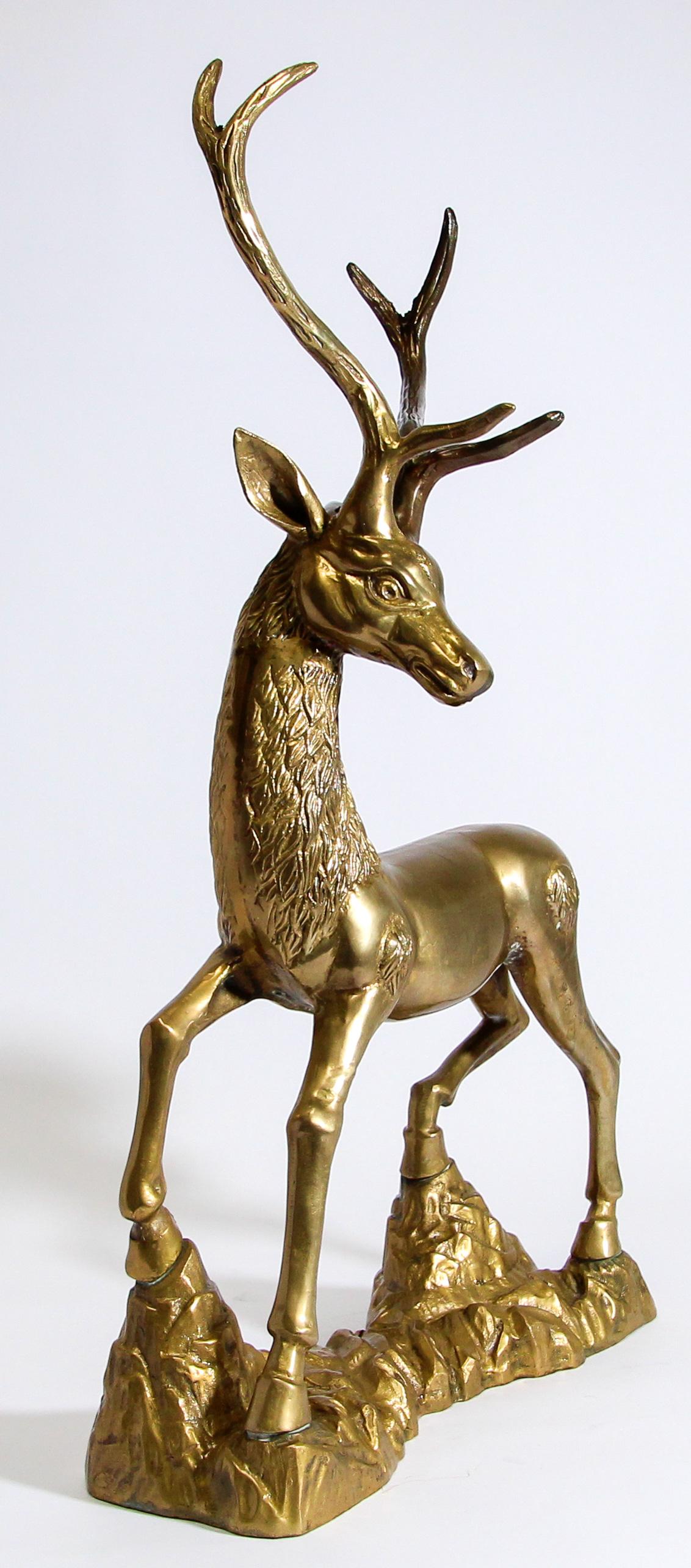 Gorgeous and substantial, striking tall iconic 1960s Hollywood Regency vintage Sarreid style cast brass standing deer sculpture with large antlers.
Large and heavy vintage midcentury solid hollow cast brass stag buck deer sculpture in great