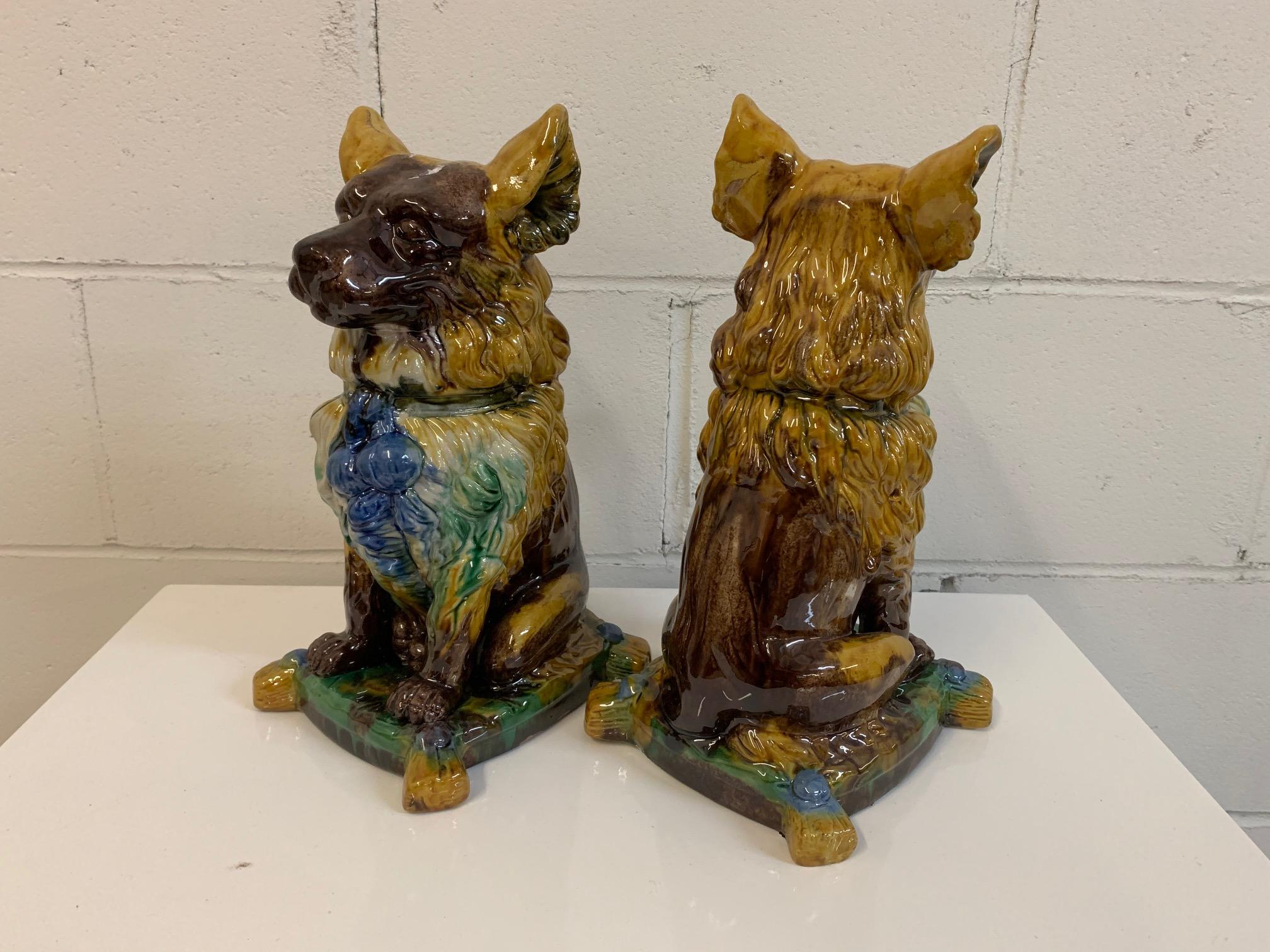 Pair of ceramic dog figurines perfect can be used as bookends or as standalone Objet d'arts. Very good condition with no flaws other than natural firing and glazing marks.