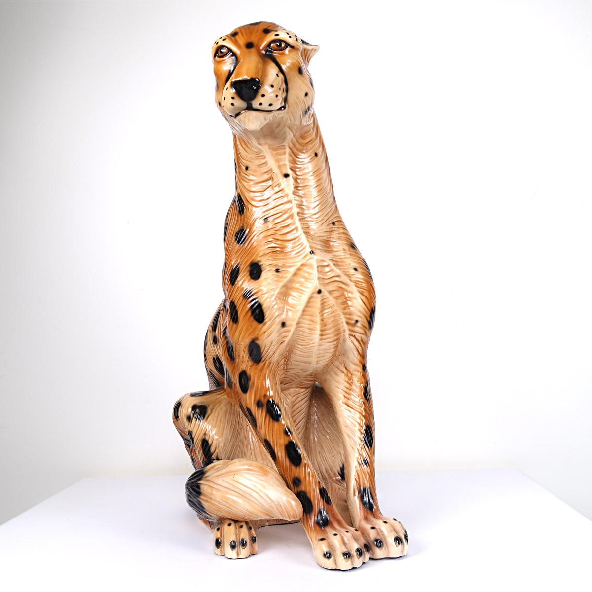 Beautiful statue of a sitting jaguar made of ceramic that is most probably cast and hand painted. Attributed to Ronzan, the Italian specialist in this field.
   