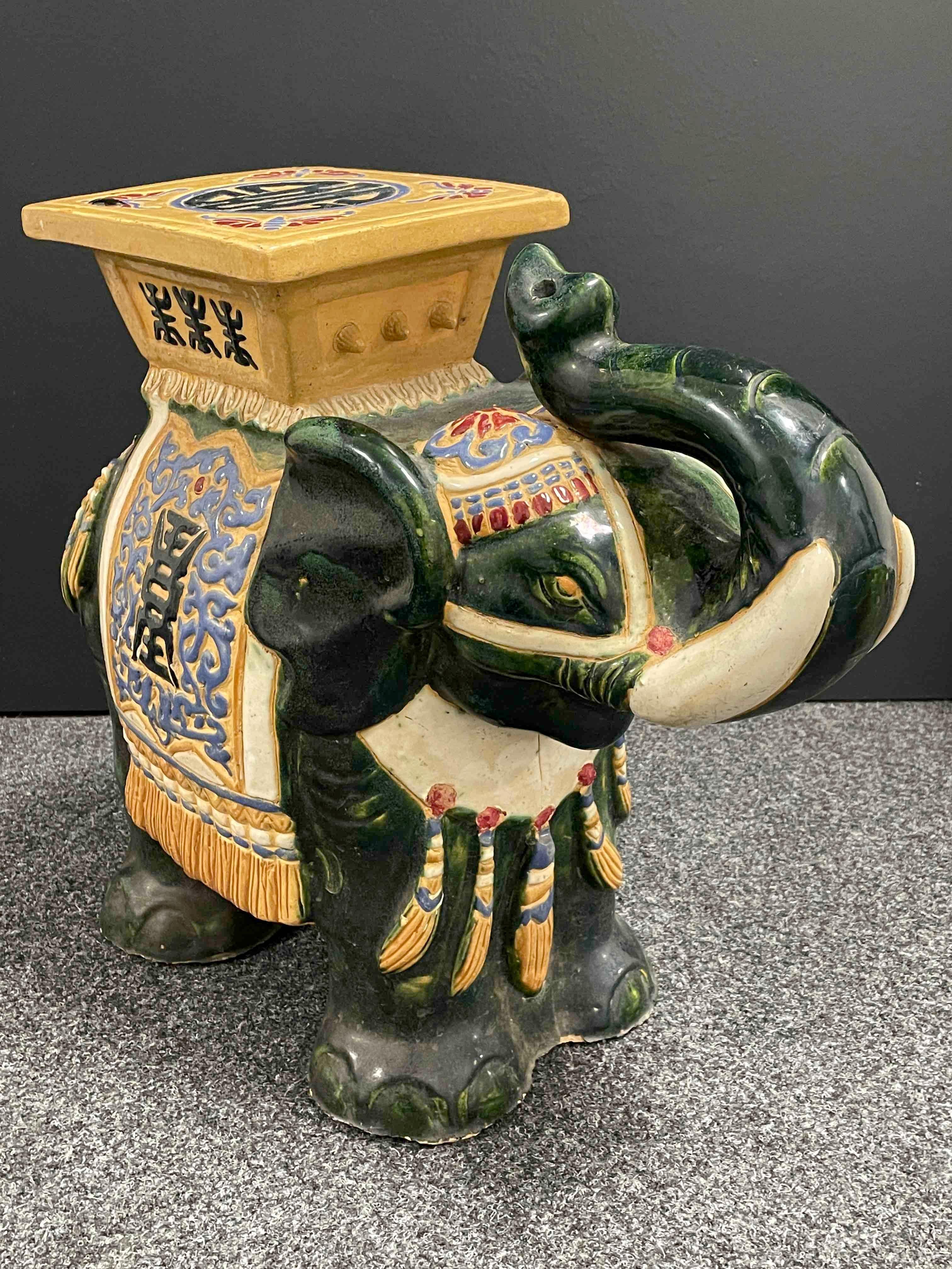green ceramic elephant plant stand