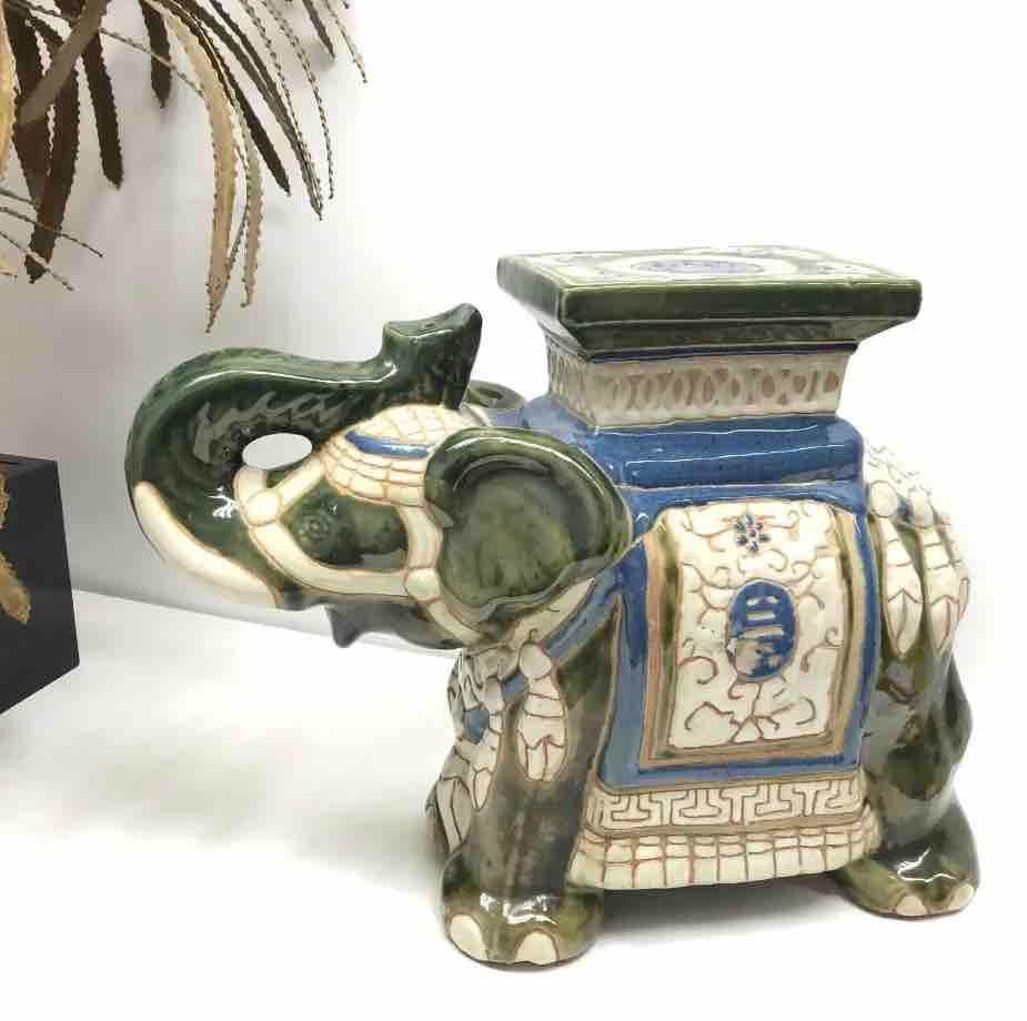 Mid-20th century glazed ceramic elephant garden stool, flower pot seat or side table. Handmade of ceramic. Nice addition to your home, patio or garden. This is in used condition, with some chips, but this is old-age.
 