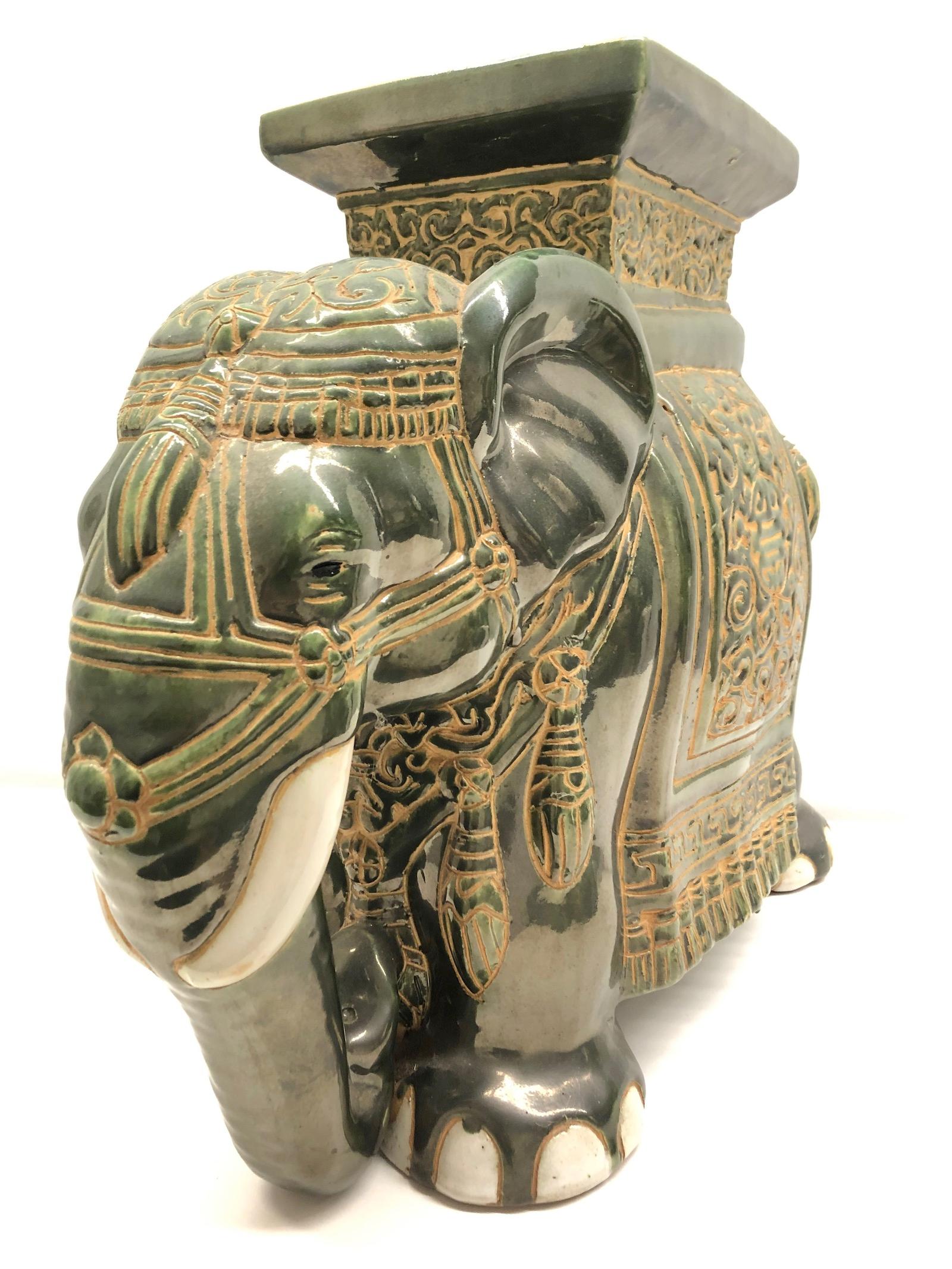 green ceramic elephant plant stand