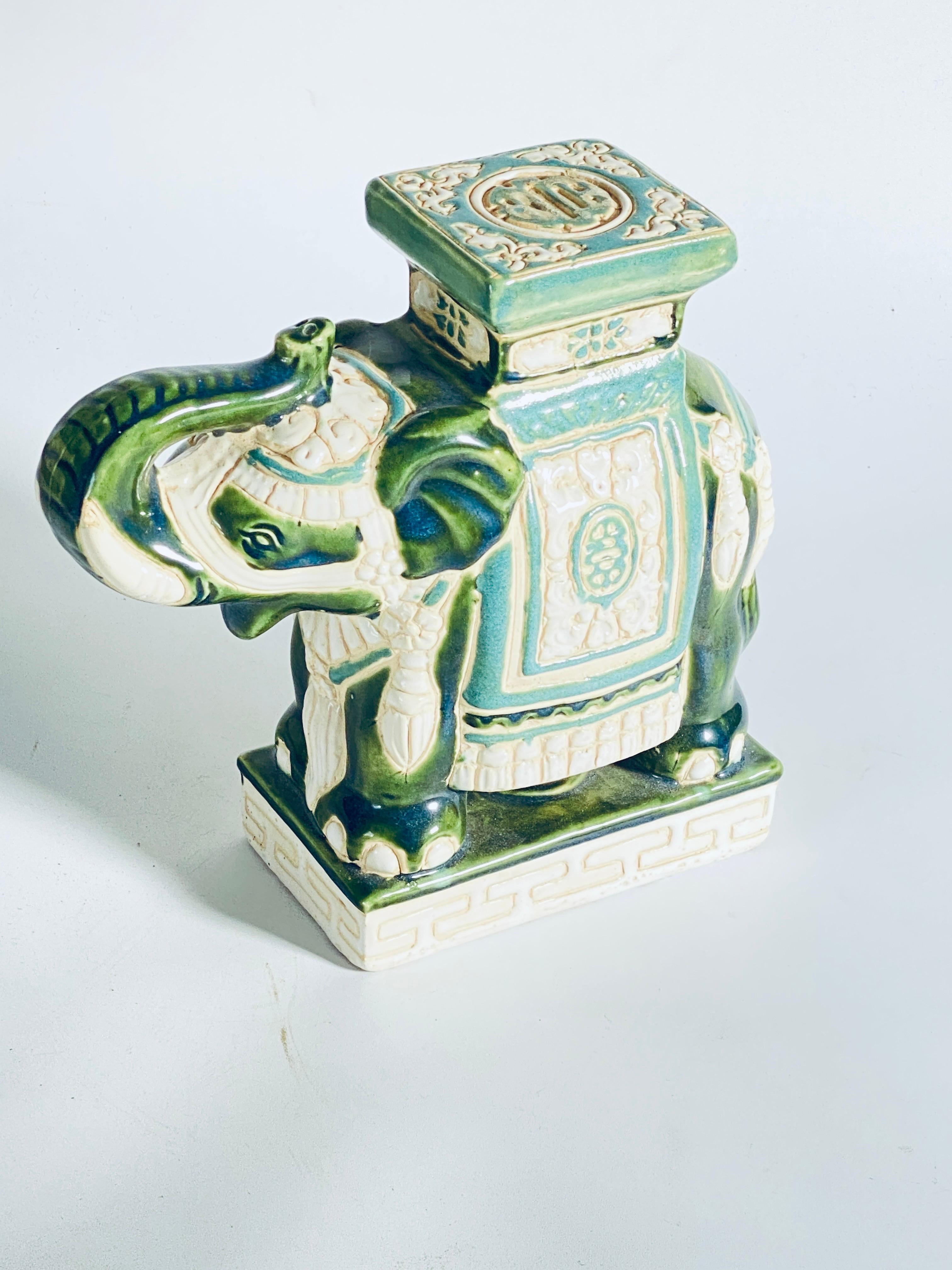 Mid-20th century glazed ceramic elephant flower plant holder.
Handmade of ceramic. Nice addition to your home, inside or Outside. This is in good condition, green color.