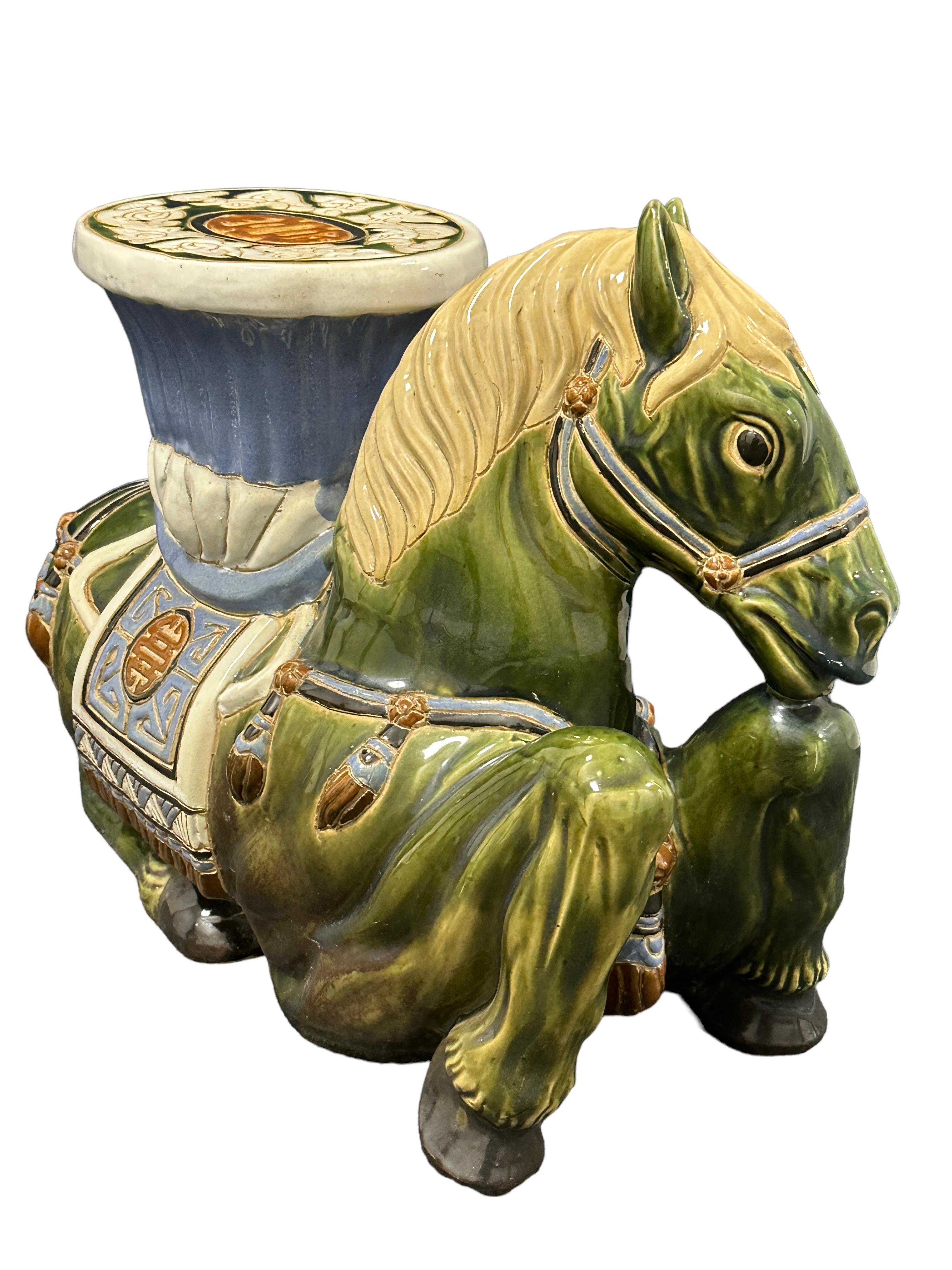 Mid-20th century glazed ceramic or terracotta garden stool plant stand or seat, flower pot seat or side table. Handmade. Vintage garden seat in the shape of an Horse with a pedestal top, all in  jade green color with blue, cream white and brown