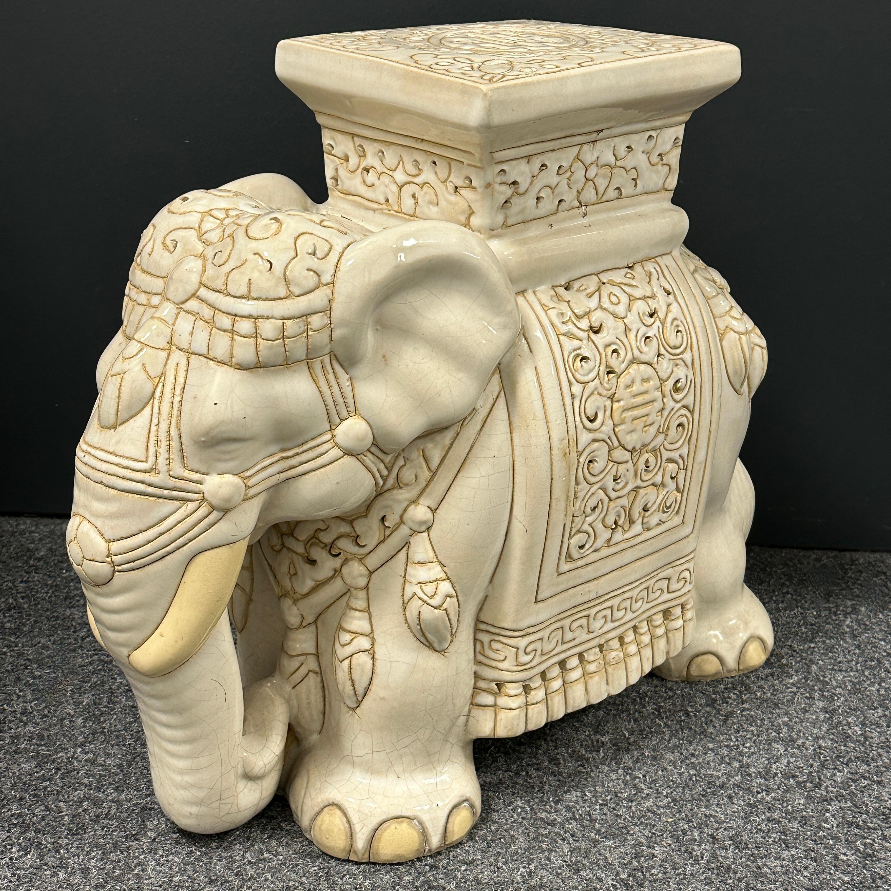 Mid-20th century glazed ceramic elephant garden stool, flower pot seat or side table. Handmade of ceramic. Nice addition to your home, patio or garden. A nice addition to any room, patio or yard. Also nice at the pool as a drinks stand.
  