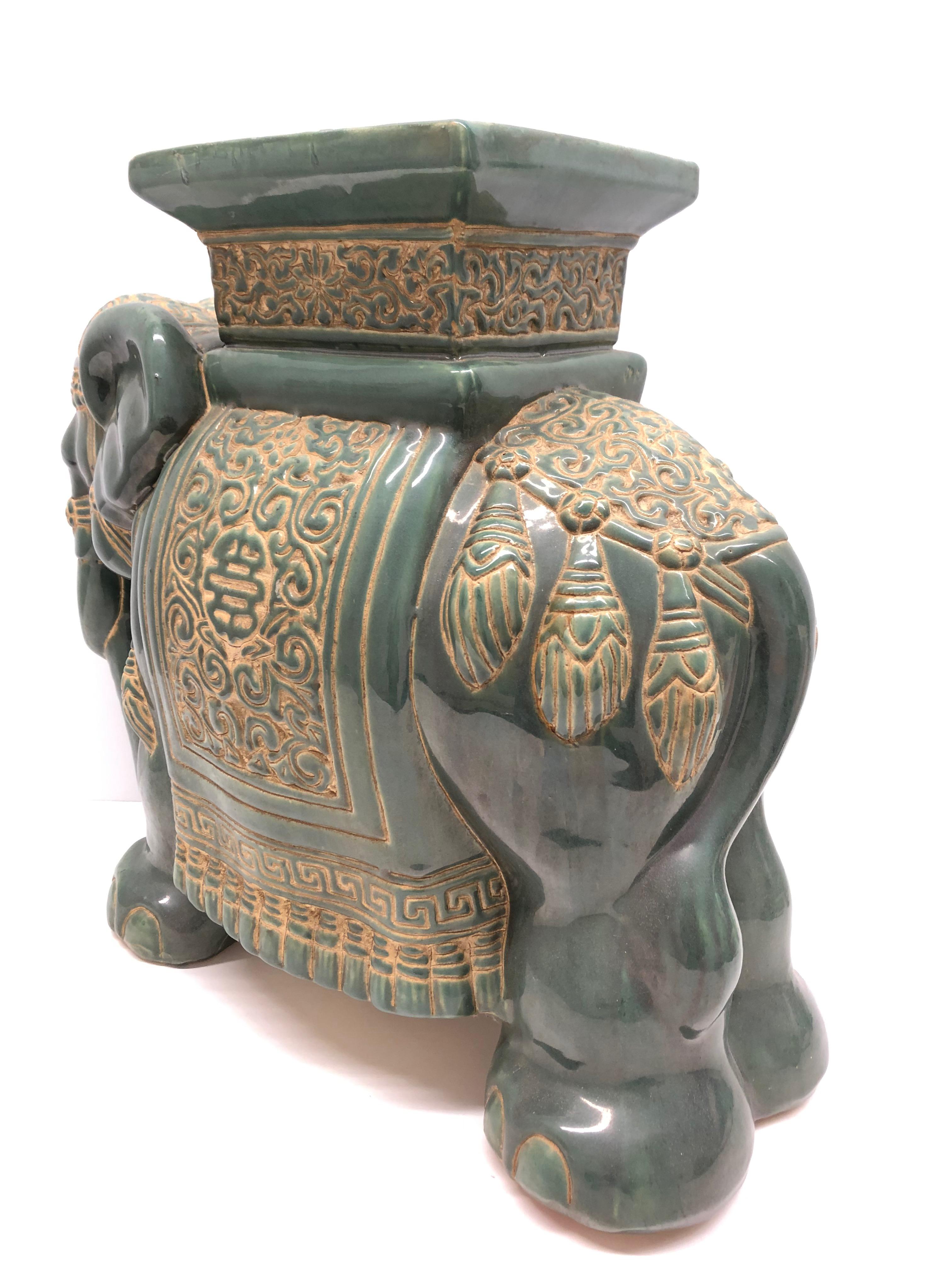 green ceramic elephant plant stand