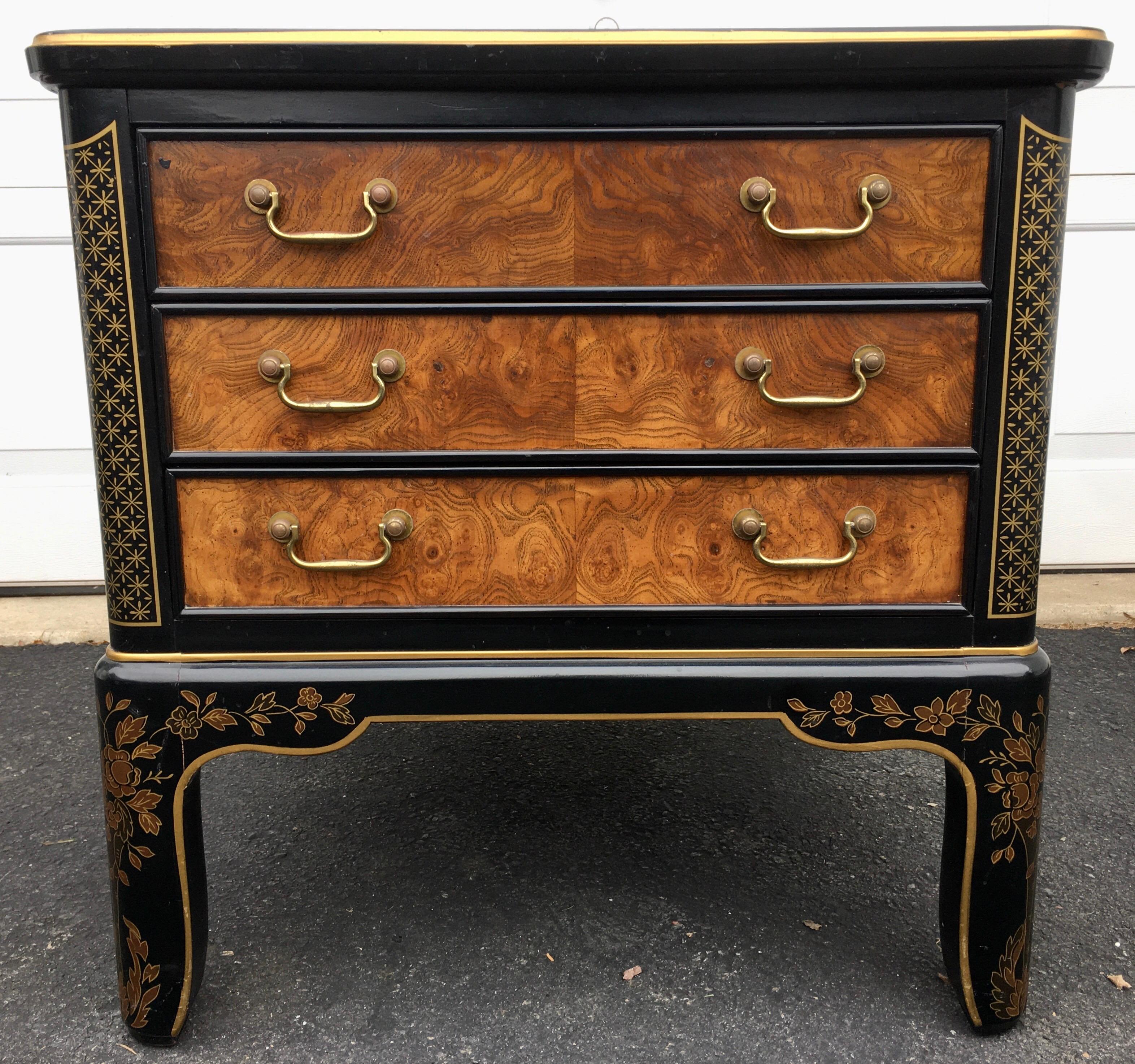 Rectangular Hollywood Regency burl wood and glass end side table by Drexel Furniture. This sculptural sofa end table features original gloss black wood frame with hand painted gold leaf detailing of fretwork and floral design. Includes original and