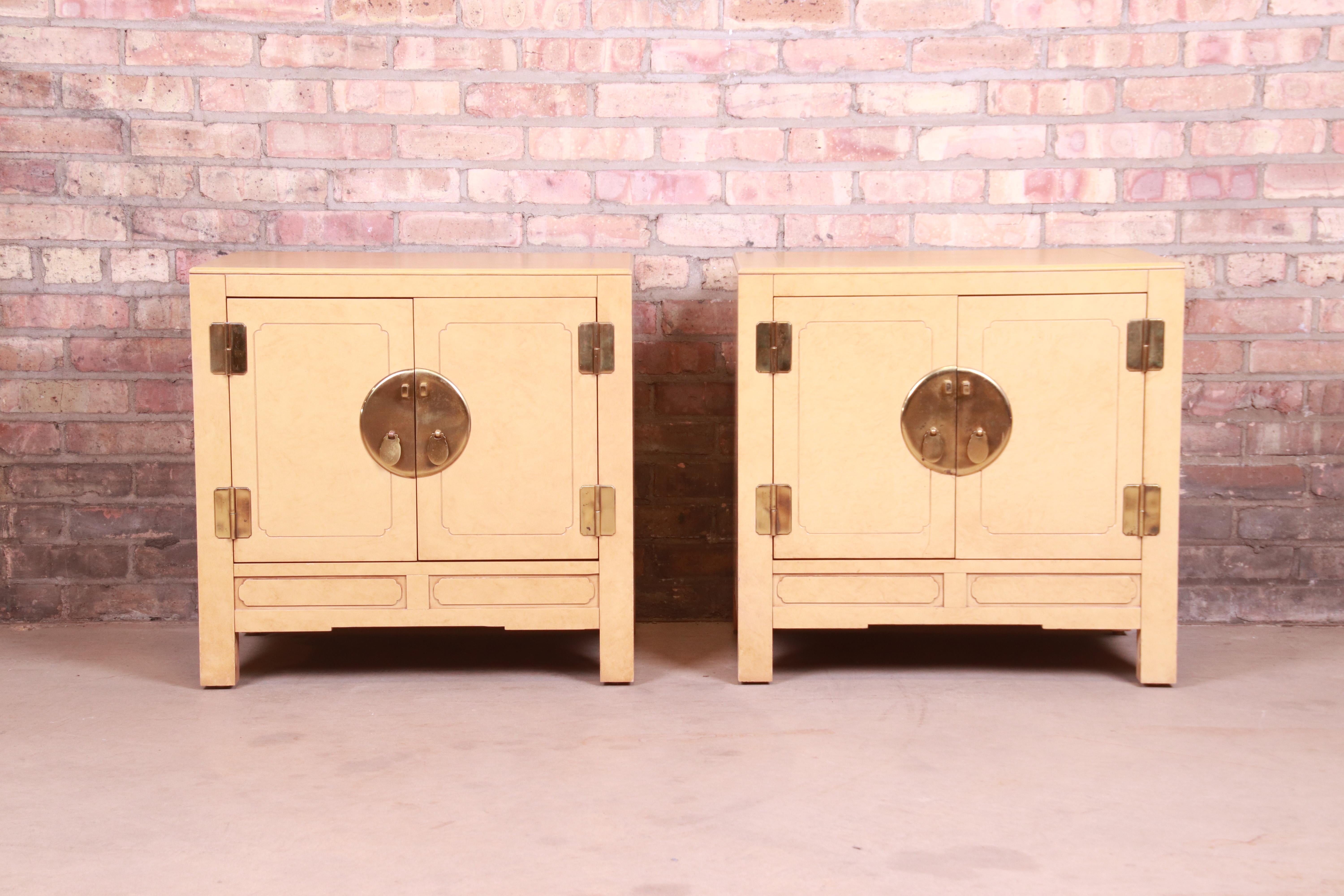 A gorgeous pair of Mid-Century Modern Hollywood Regency Chinoiserie style nightstands

By White Furniture

USA, Circa 1970s

Wood with lacquered faux goatskin finish, and original Asian-inspired brass hardware.

Measures: 25