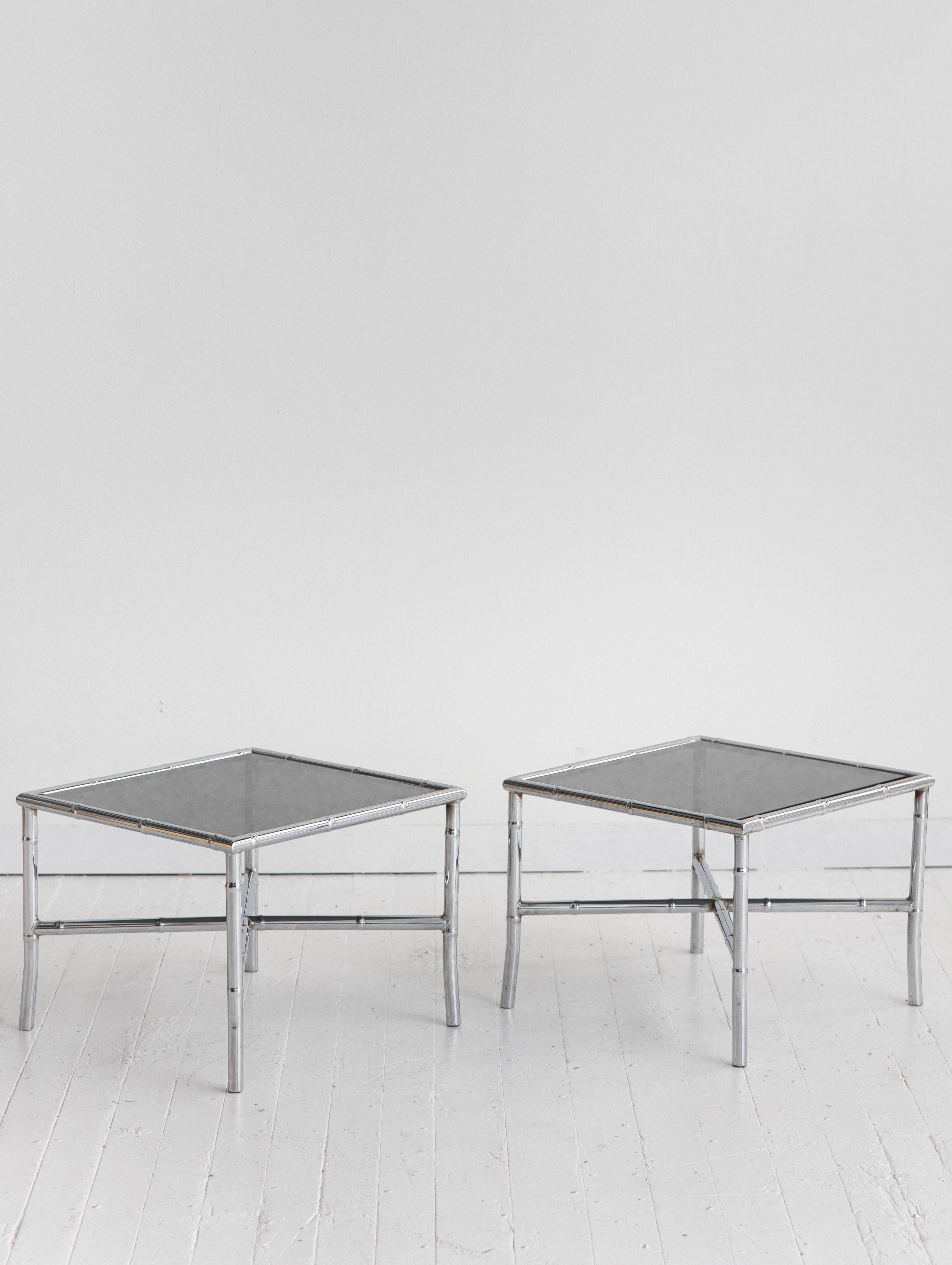 Hollywood Regency style chrome coffee table pair with smoke glass tops. Faux bamboo effect. Can be used together to create a longer coffee table, as side tables, or occasional tables.