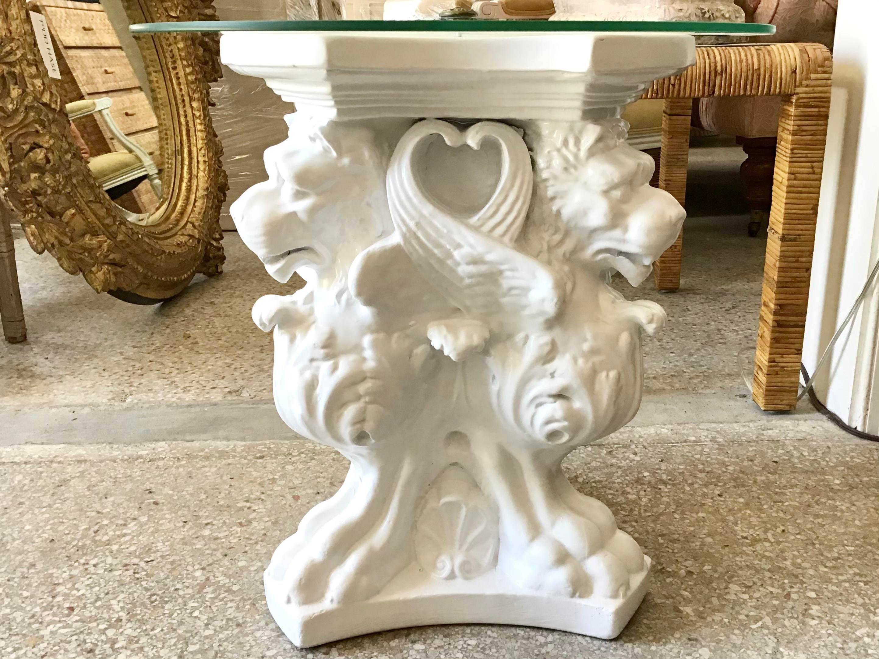 Wonderful white cocktail table with a nicely griffins carved base and a glass top. Add this wonderful drink table to your bar or even your studio.