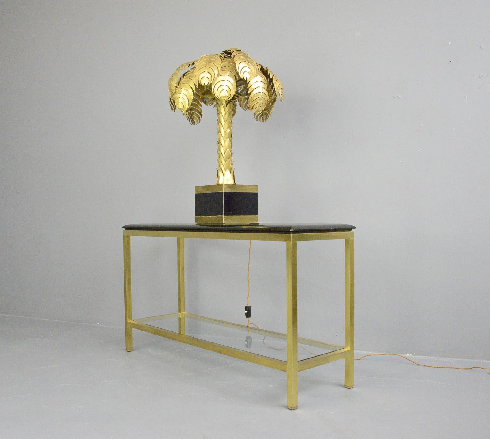 Hollywood Regency console table Circa 1970s

- Brass frame
- Bevelled toughened glass top
- Toughened glass bottom shelf
- French ~ 1970s
- Measures: 131cm long x 41cm deep x 73cm tall

Condition report

Some light scratches to the top and