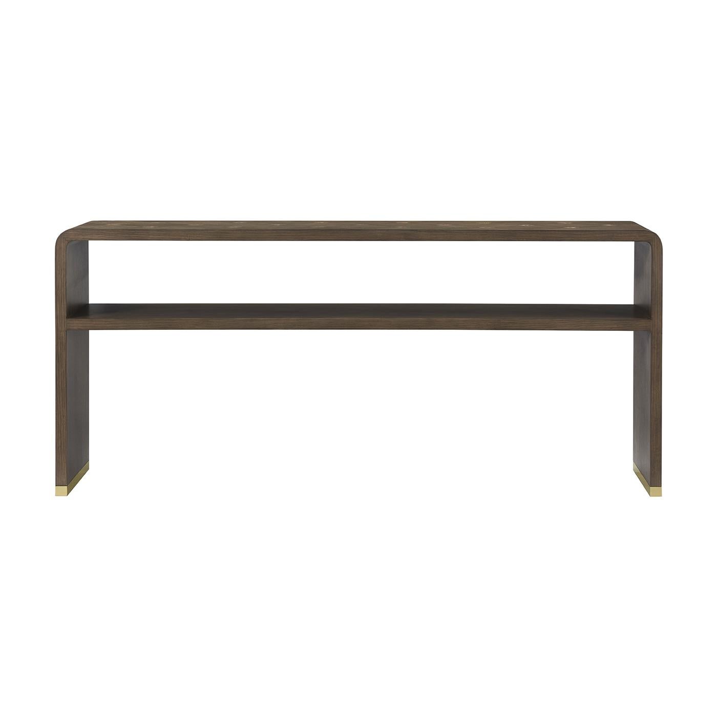 In a dark wood mink finish, the table brings sculptural elegance to refined interiors. Its waterfall-edge silhouette is accented with delicate diamond-pattern inlays across the top and sides, creating a soft sense of movement.

A full-length lower
