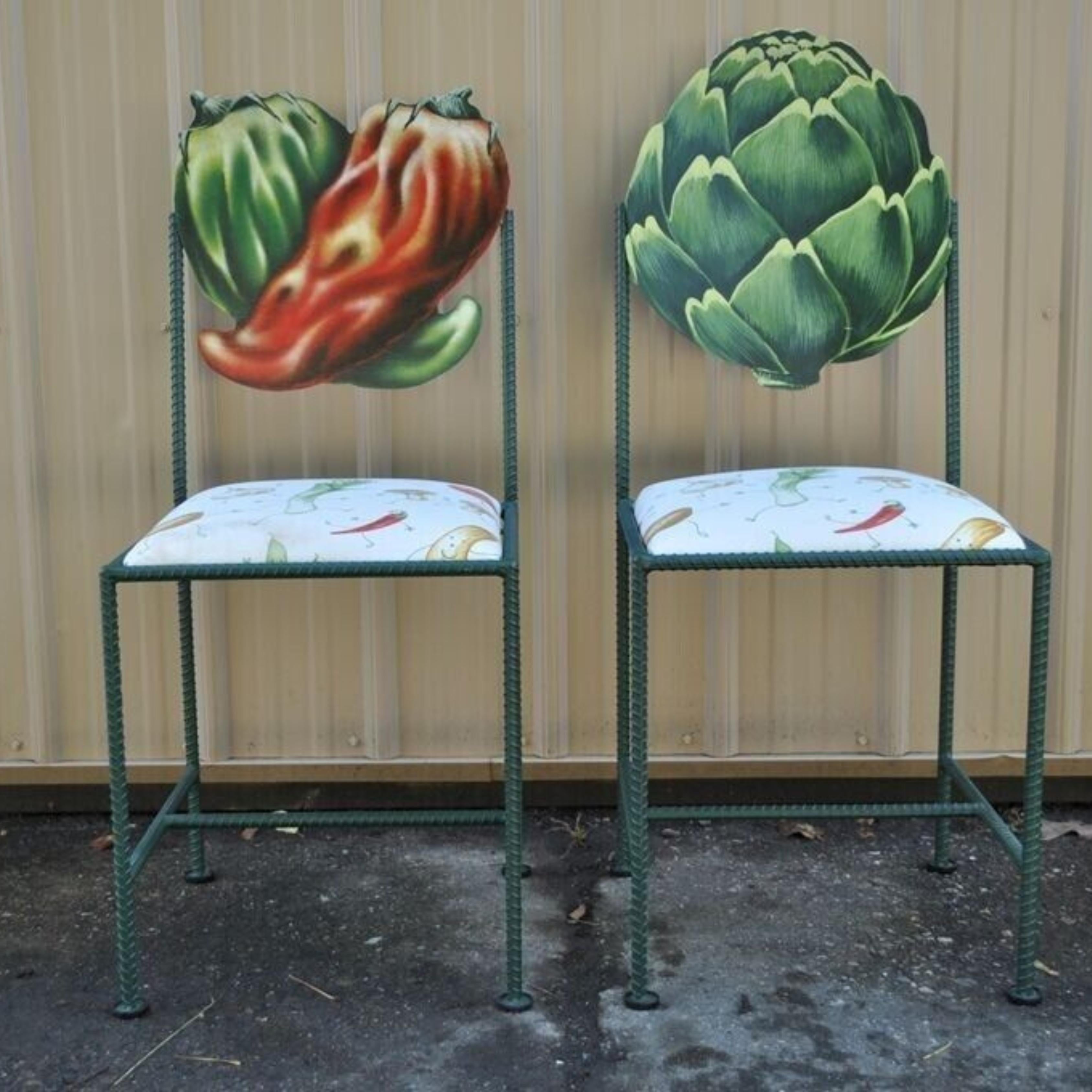 Hollywood Regency Custom Painted Peppers & Artichoke Bistro Side Chairs - a Pair. Item featured has a painted rear, great style and form. Signature by unknown artist. Circa Late 20th Century.
Measurements: 
Pepper Chair: 37.75