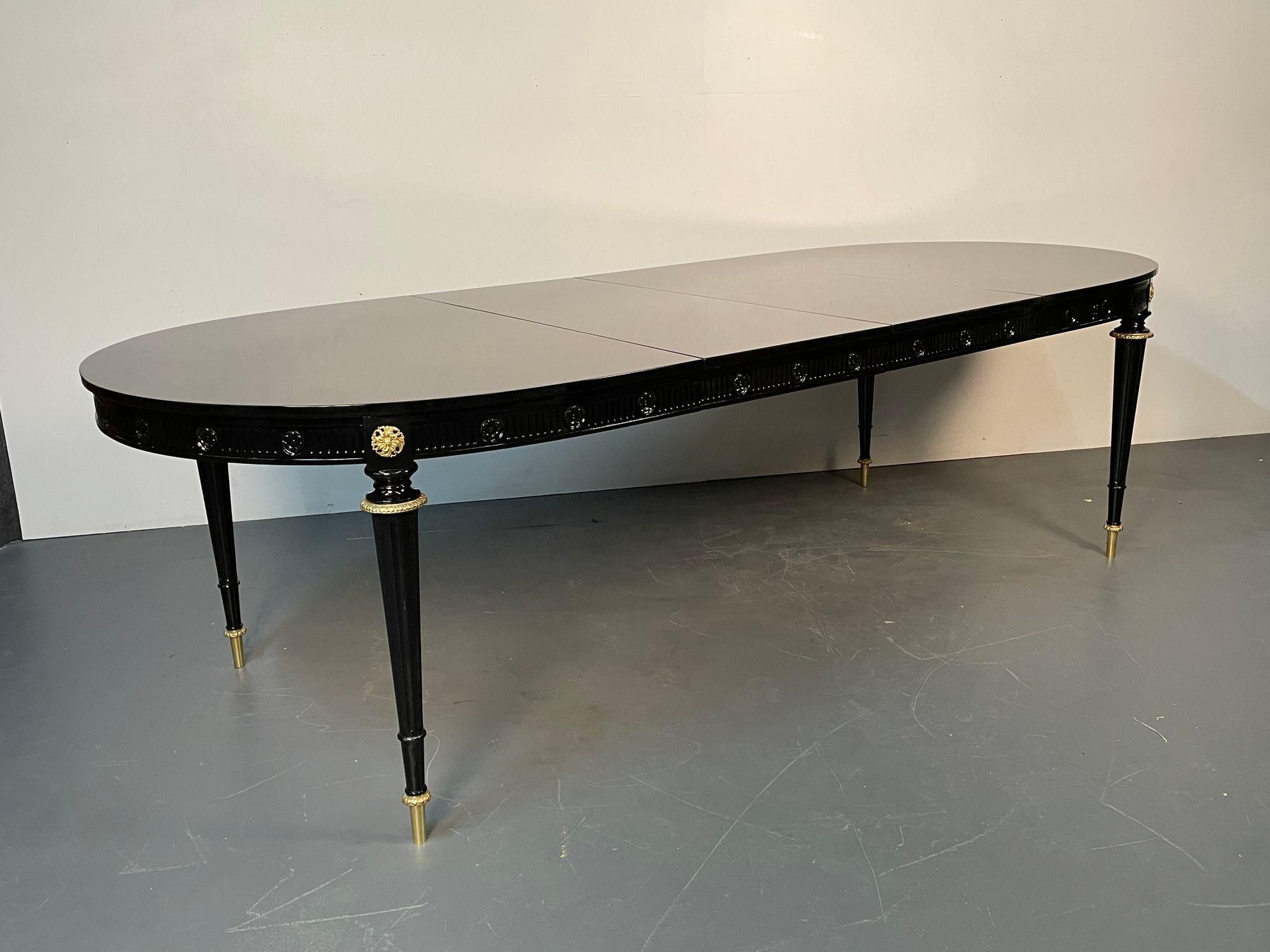Hollywood Regency Dining Table, Jansen Style, Ebony Lacquer, Hand Carved, Bronze
This stunning recently refinished dining table in the manner of Maison Jansen is simply spectacular. A rare and important dining table having thin tapering legs