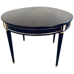 Table de salle à manger ronde en bois d'ébène style Maison Jansen avec monture en bronze Hollywood Regency