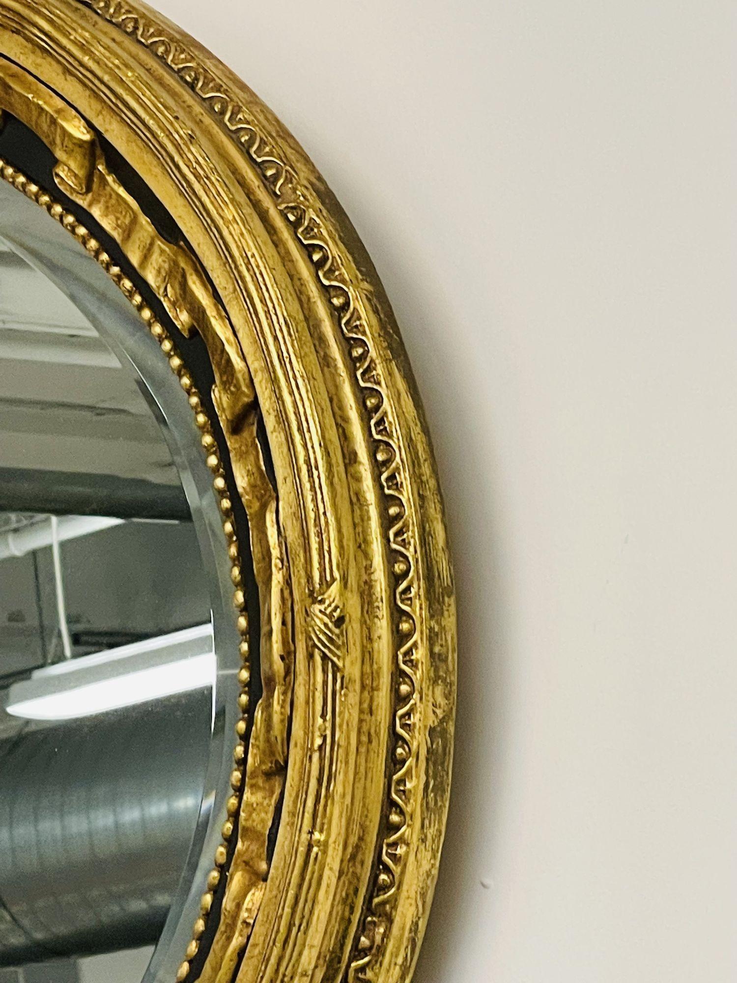 Hollywood Regency Ebony and Gilt Wall, Console or Mantle Mirror In Good Condition In Stamford, CT