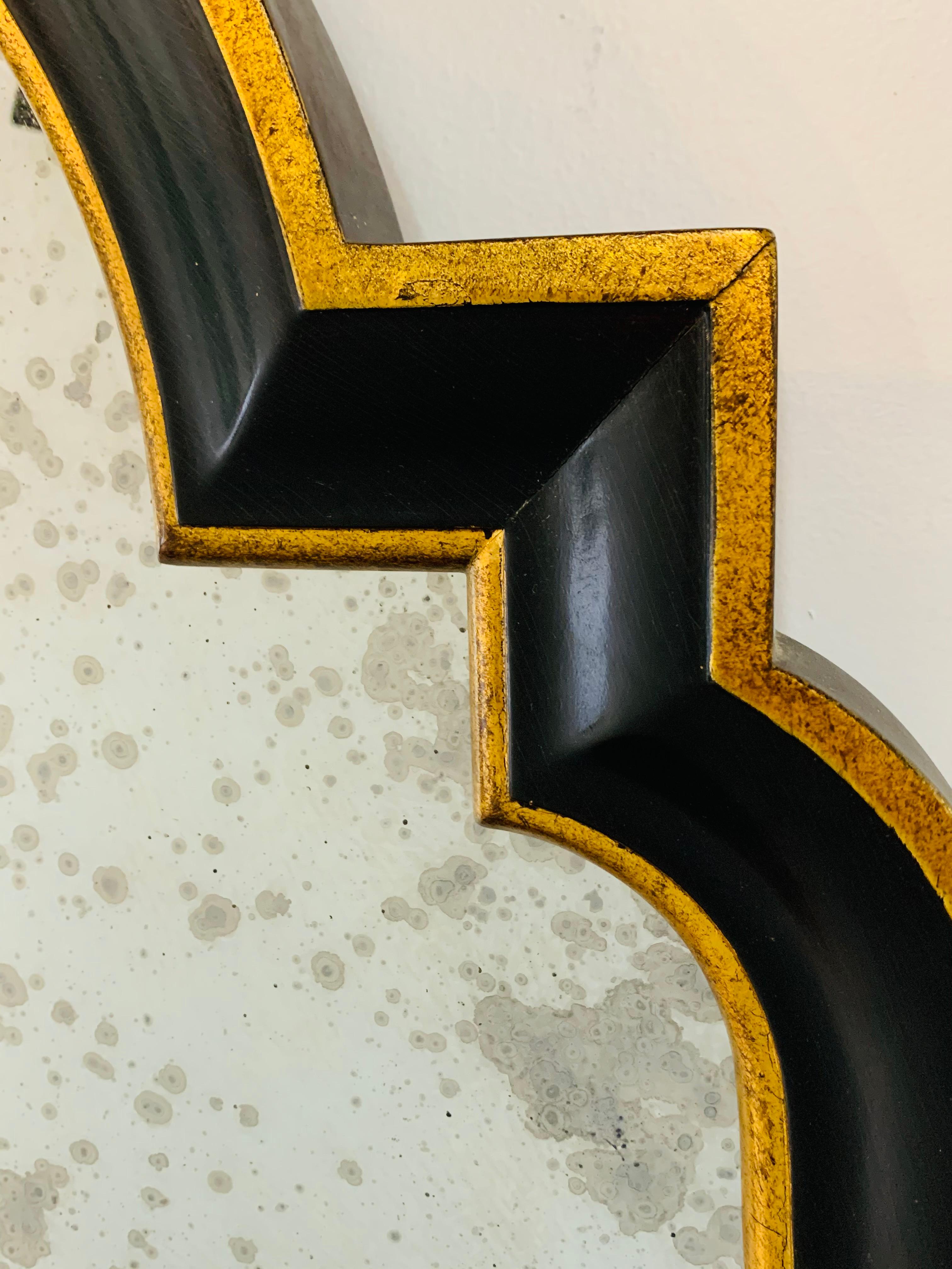 Hollywood Regency Ebony Black and Gold Antiqued Glass Wall or Mantel Mirror  In Good Condition For Sale In Plainview, NY