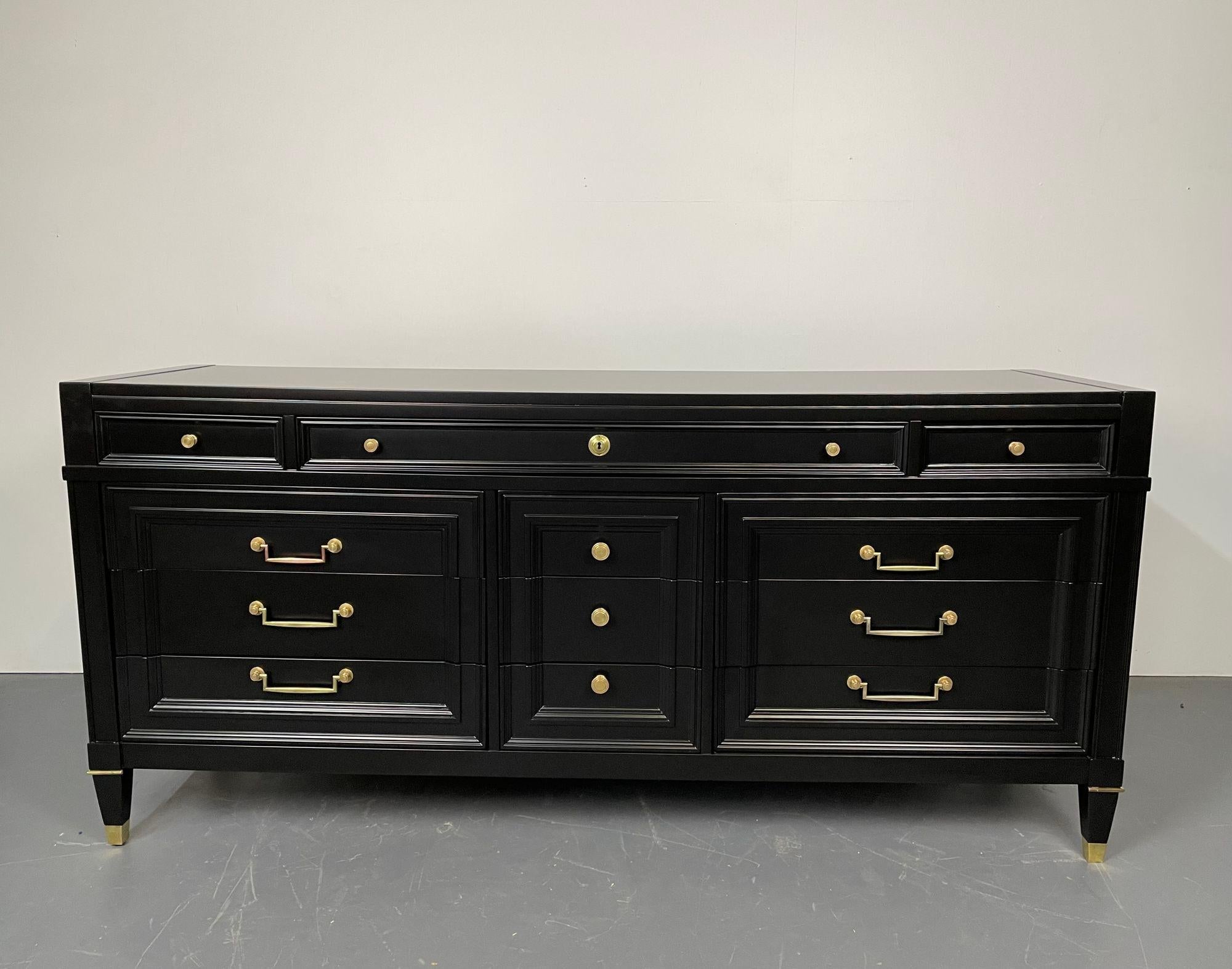 Hollywood Regency Ebony dresser, 12 drawer, Refinished
A Stunning Ebony dresser, sideboard or chest having a rare grouping of 12 drawers each with bronze drawer pulls in the Maison Jansen Style. The tapering legs have bronze sabots and terminals