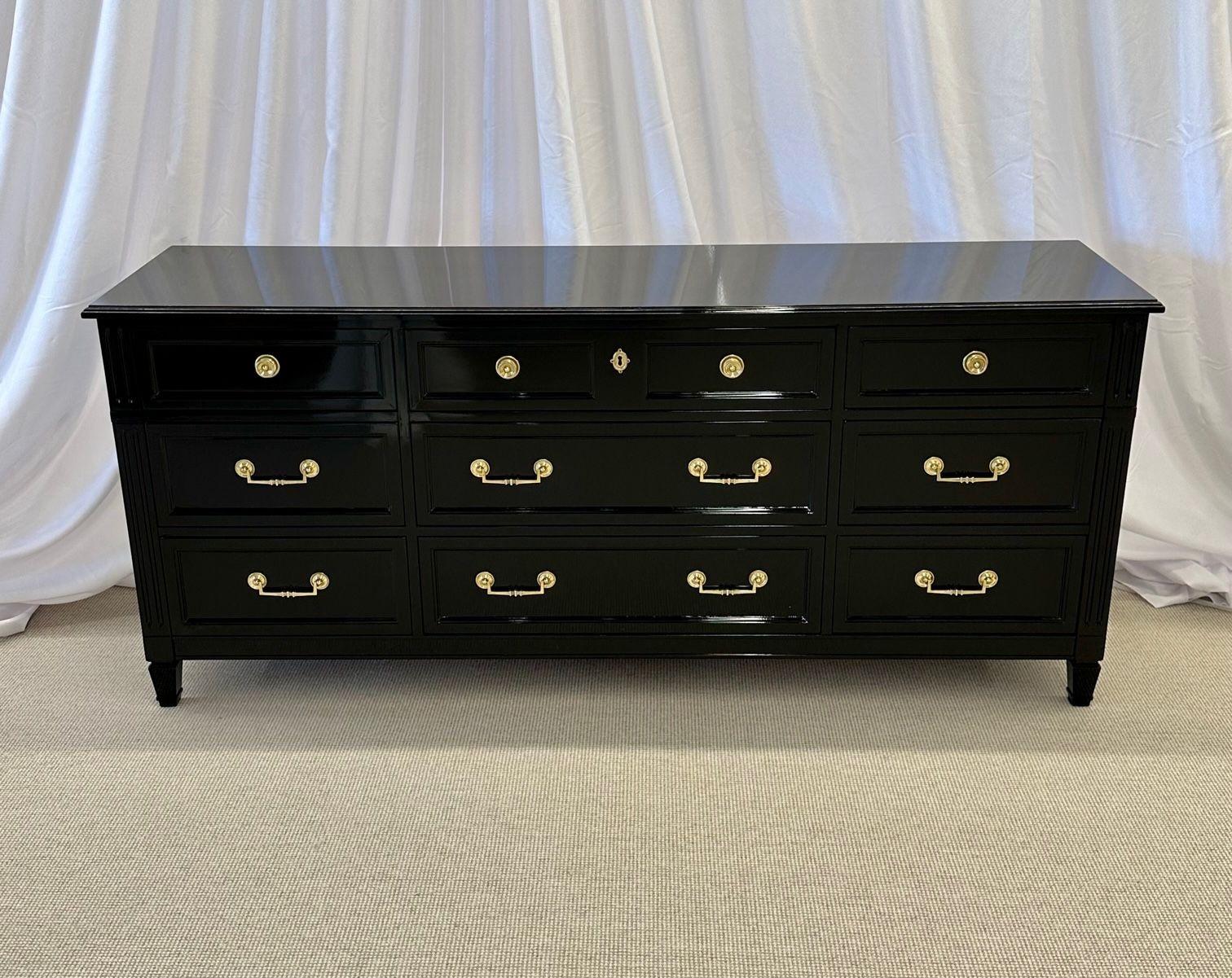 Hollywood Regency Ebony dresser, sideboard, chest, commode or cabinet, bronze Hollywood regency 
A Mid-Century Modern Ebony dresser or Chest fully refinished in the Hollywood Regency Fashion. Three smaller drawers above six larger drawers make this