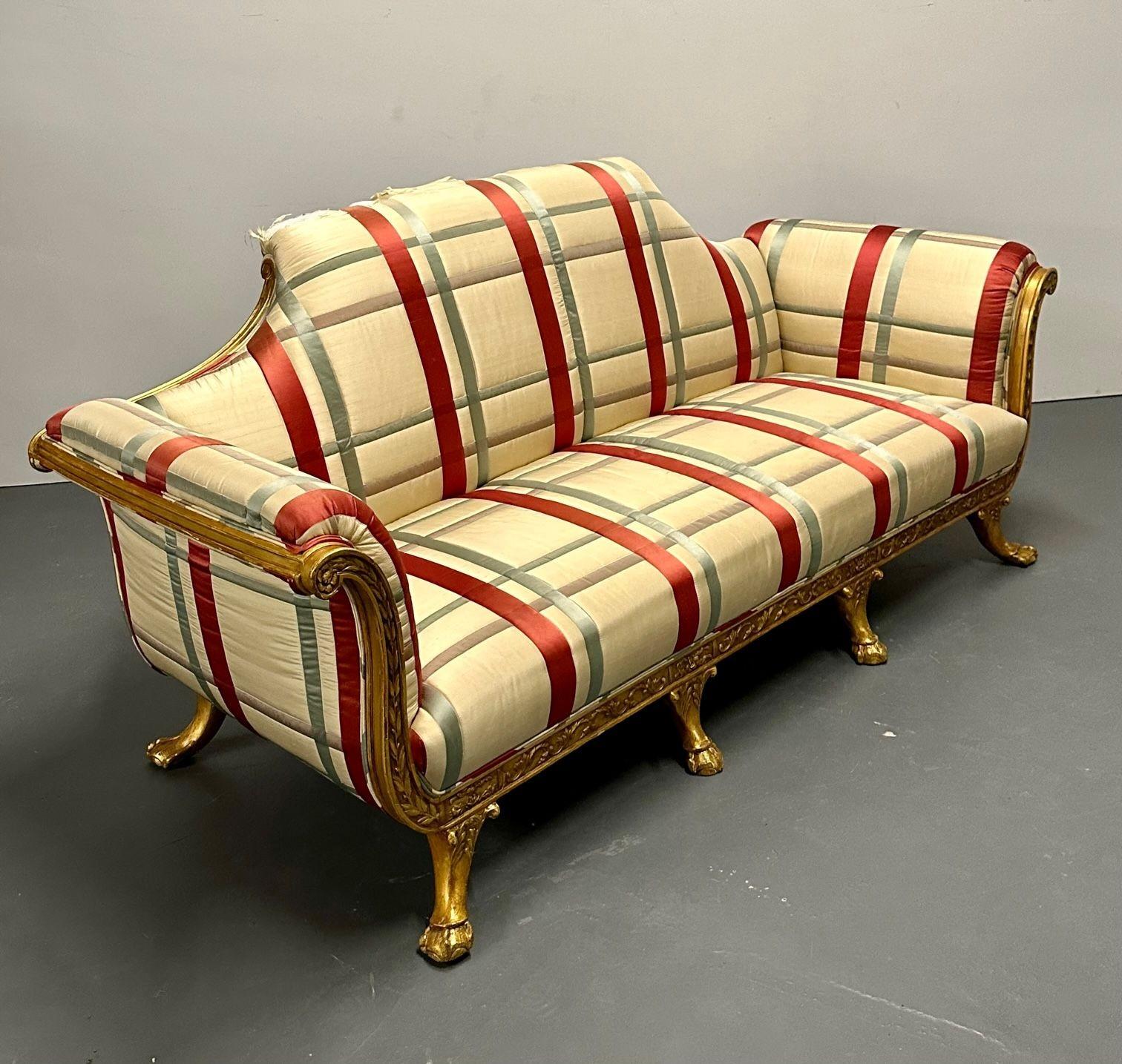 Hollywood Regency Eccentric Giltwood, Carved Sofa / Settee, Satin
 
This unusual sofa has a finely carved, 8-leg giltwood frame that features a dramatic camel back design.  Striped satin upholstery is striking but torn at the back.  Two generously