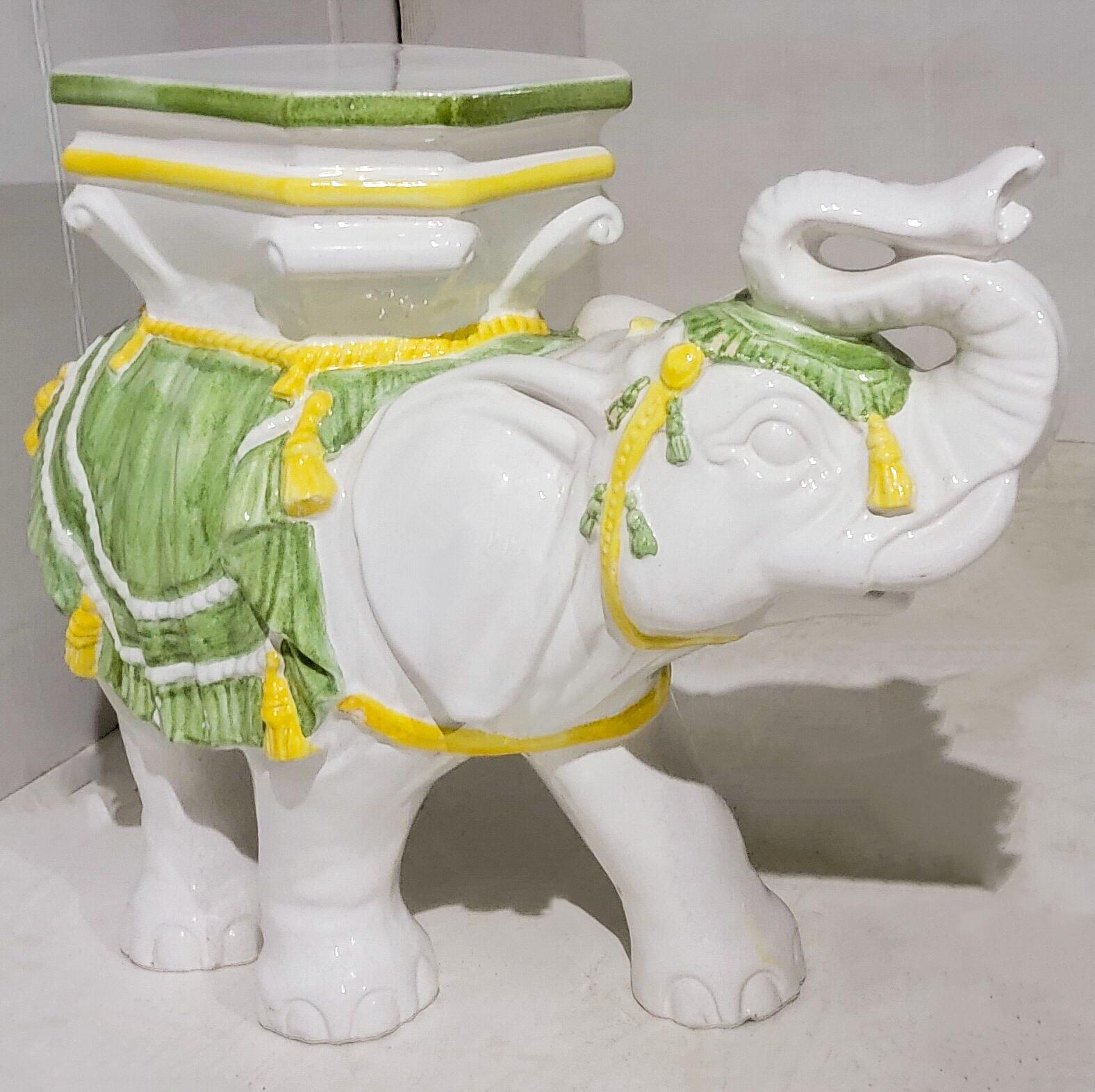 This s is a Hollywood Regency Era elephant garden seat in a vivd green and yellow coloration. He is in very good condition. Heavy!