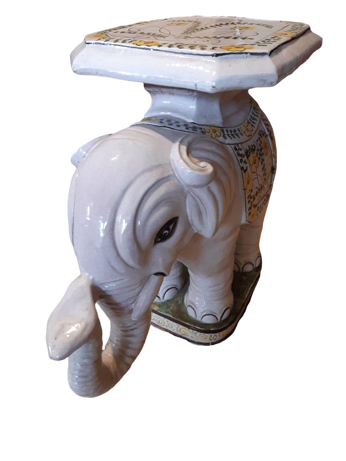 blue and white elephant plant stand