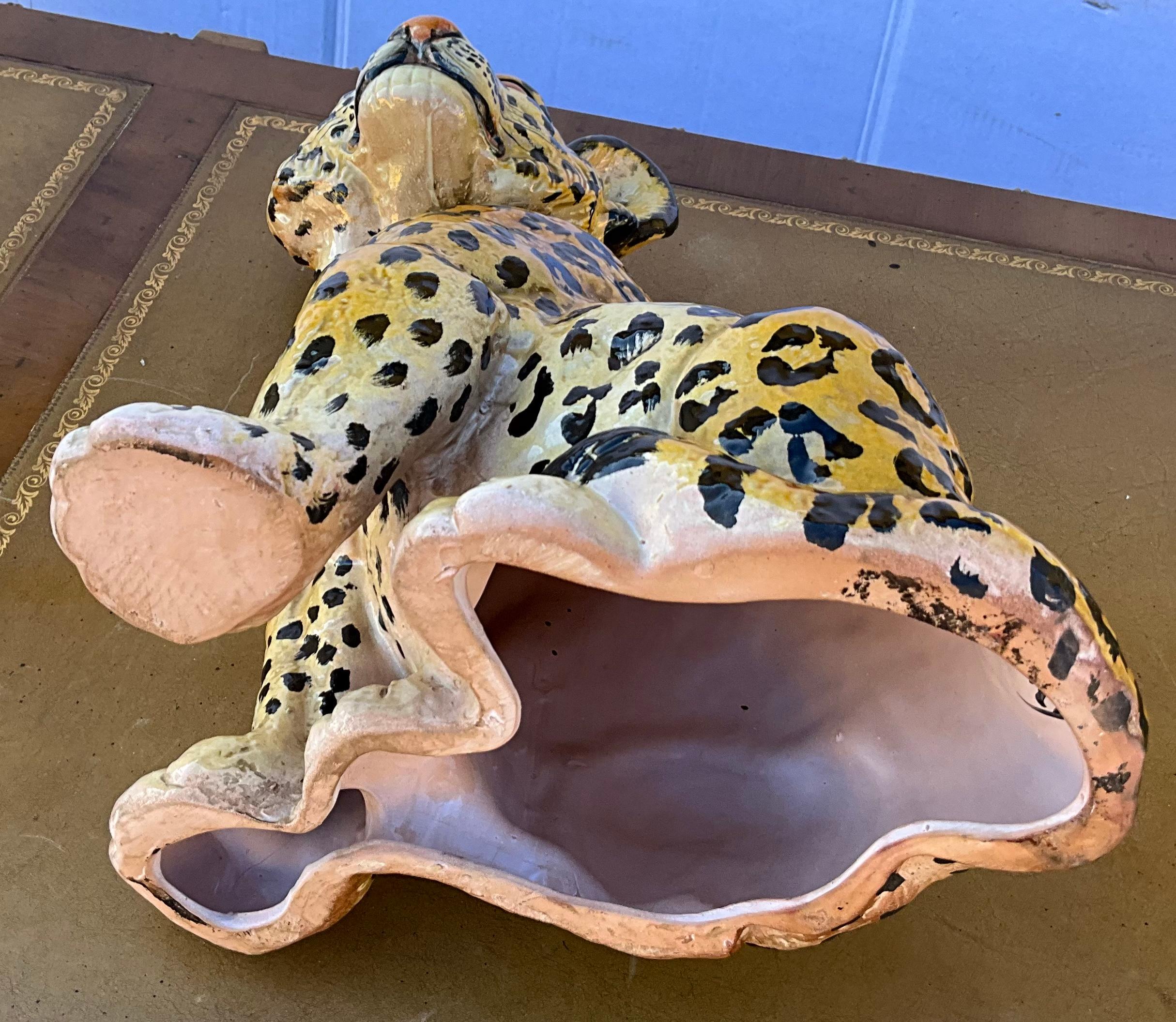 Love this! It is a Hollywood Regency eta large scale Italian terracotta leopard cub. He is in very good condition.