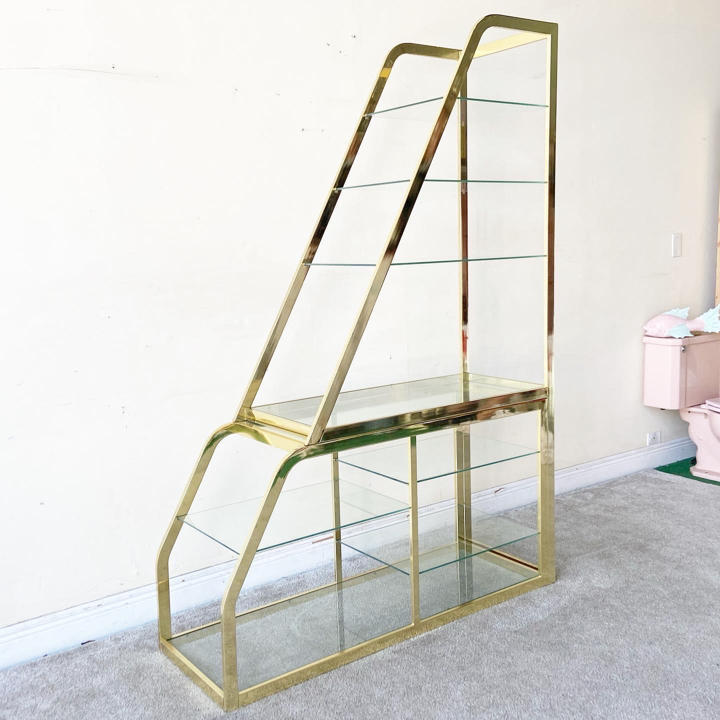 Excellent large extendable gold etagere by DIA. Features glass shelving and can be opened up to nearly double the width.

Extends to 89.75”W
Lower section measures 27.5”H.