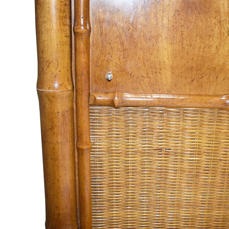 Hollywood Regency or Chinoiserie style faux bamboo queen size canopy bed. A fabulous way to add a touch of Palm Beach style to any bedroom. This bed is created of faux bamboo and features a tall bamboo headboard and an overhead canopy. At the top of