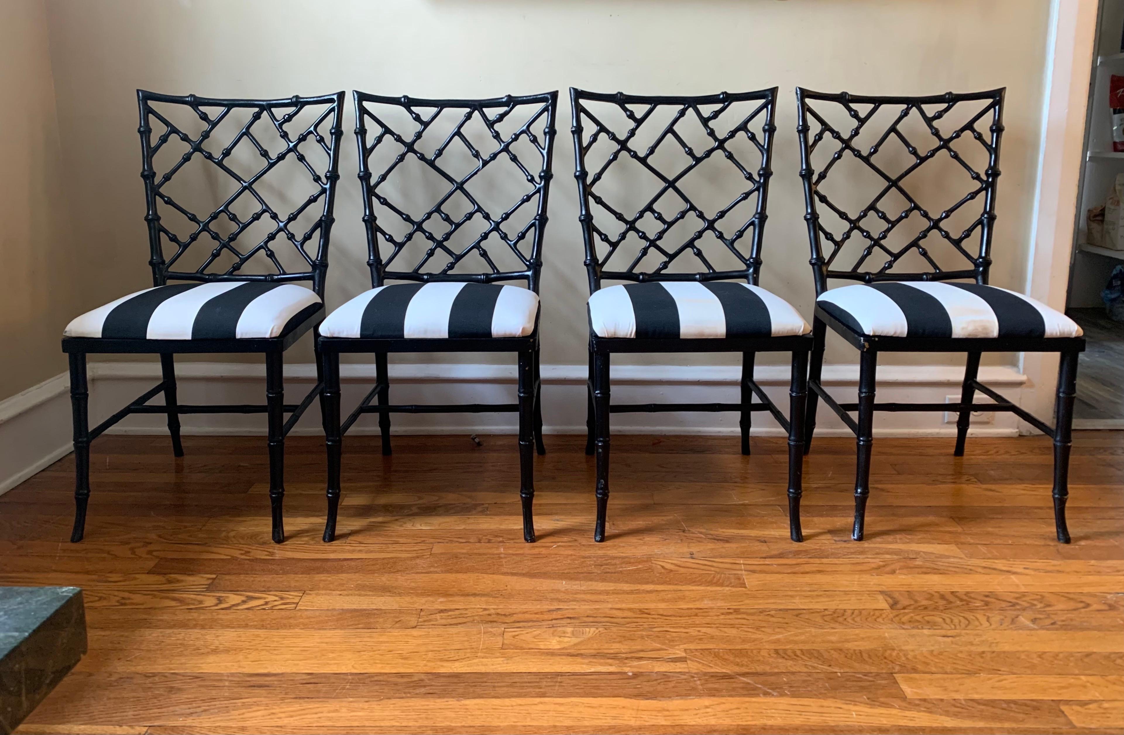 A scarce set of 4 faux-bamboo lattice chairs, designed by Phyllis Morris.

These chairs are in superb condition, freshly sanded & painted black. 

Black & white striped upholstery is in good condition with minor age spots.

Scarce to find