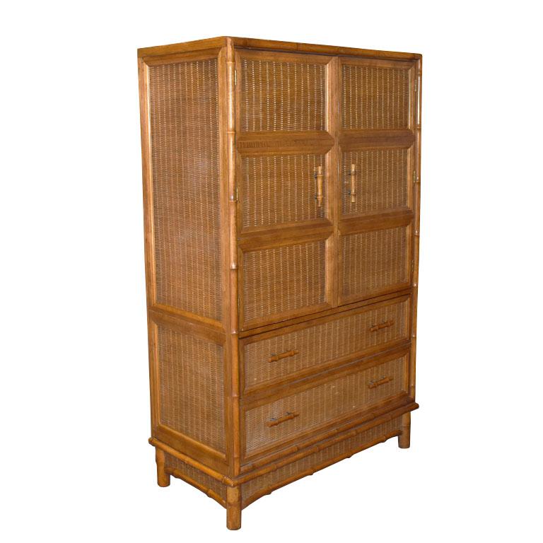 A fabulous Hollywood Regency Chinoiserie faux bamboo tall chest of drawers or media cabinet. Created by American of Martinsville, this timeless piece will compliment nearly any space. The sides and front are swathed in beautiful brown wicker. The
