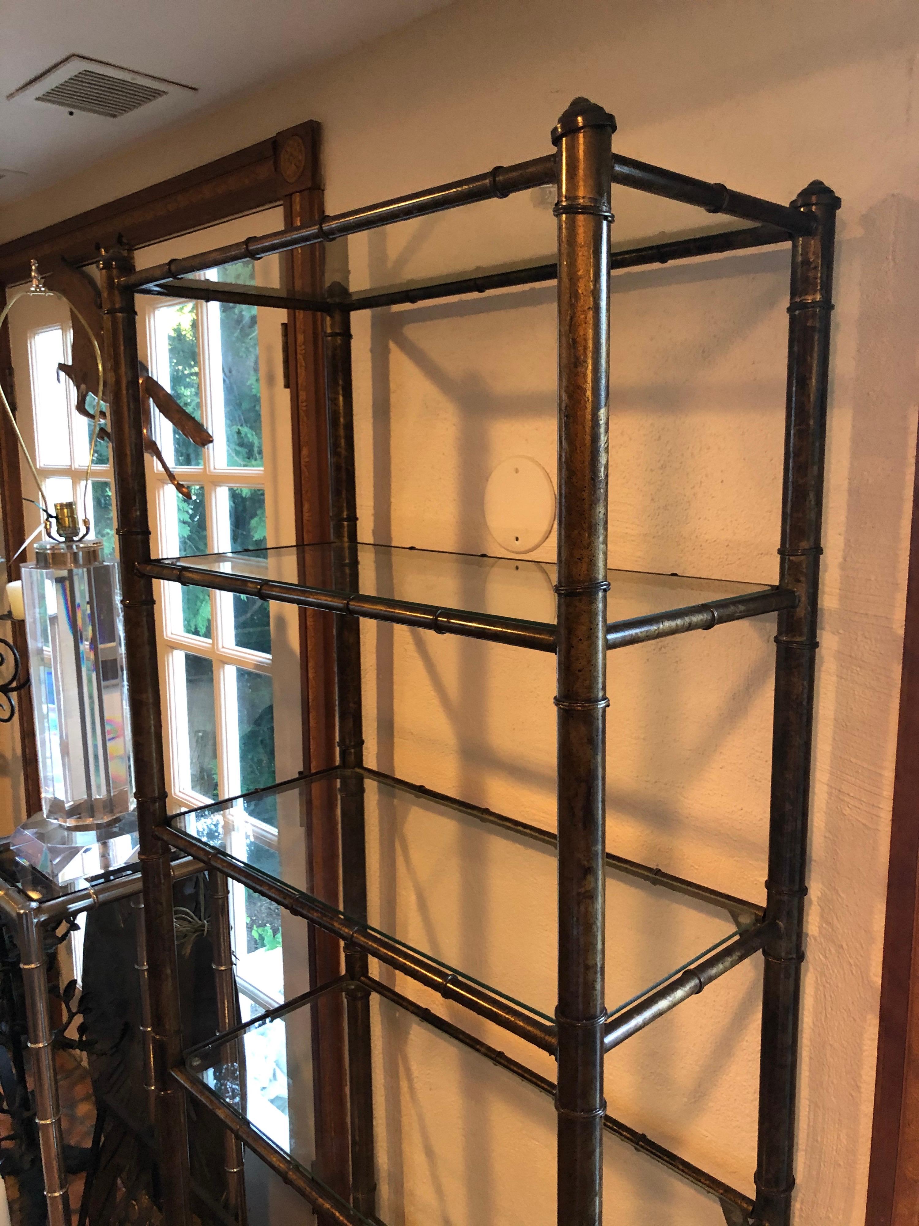 Hollywood Regency faux bamboo étagère. This lovely 6 shelf glass and metal bookcase has ample storage for your books or collectibles. Classic and timeless in style.