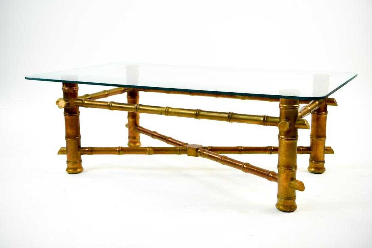 Large scale carved wood gilt faux bamboo coffee table with glass top.