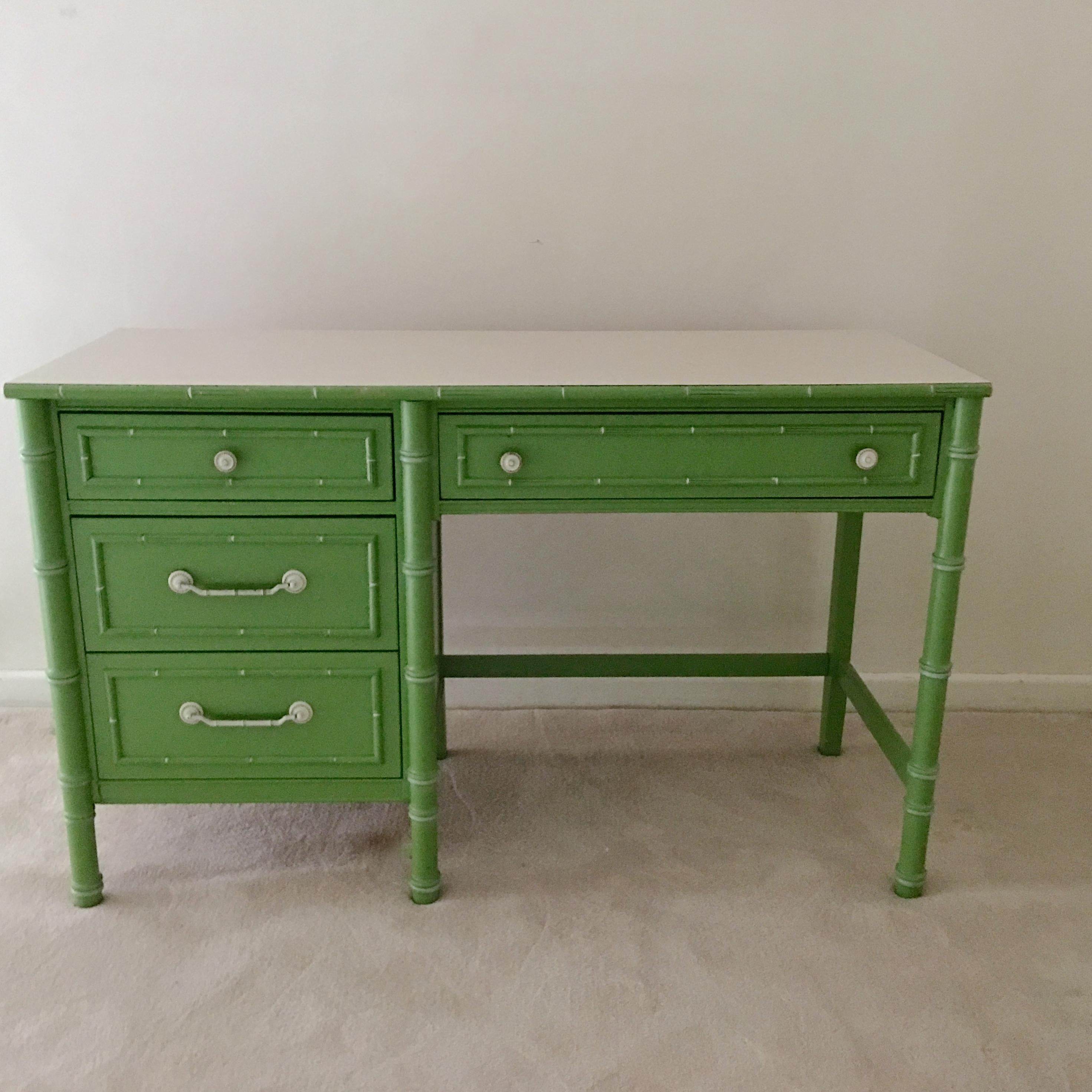 Thomasville Allegro faux bamboo desk in original preppy pistachio green with white striated formica top and four drawers.

 