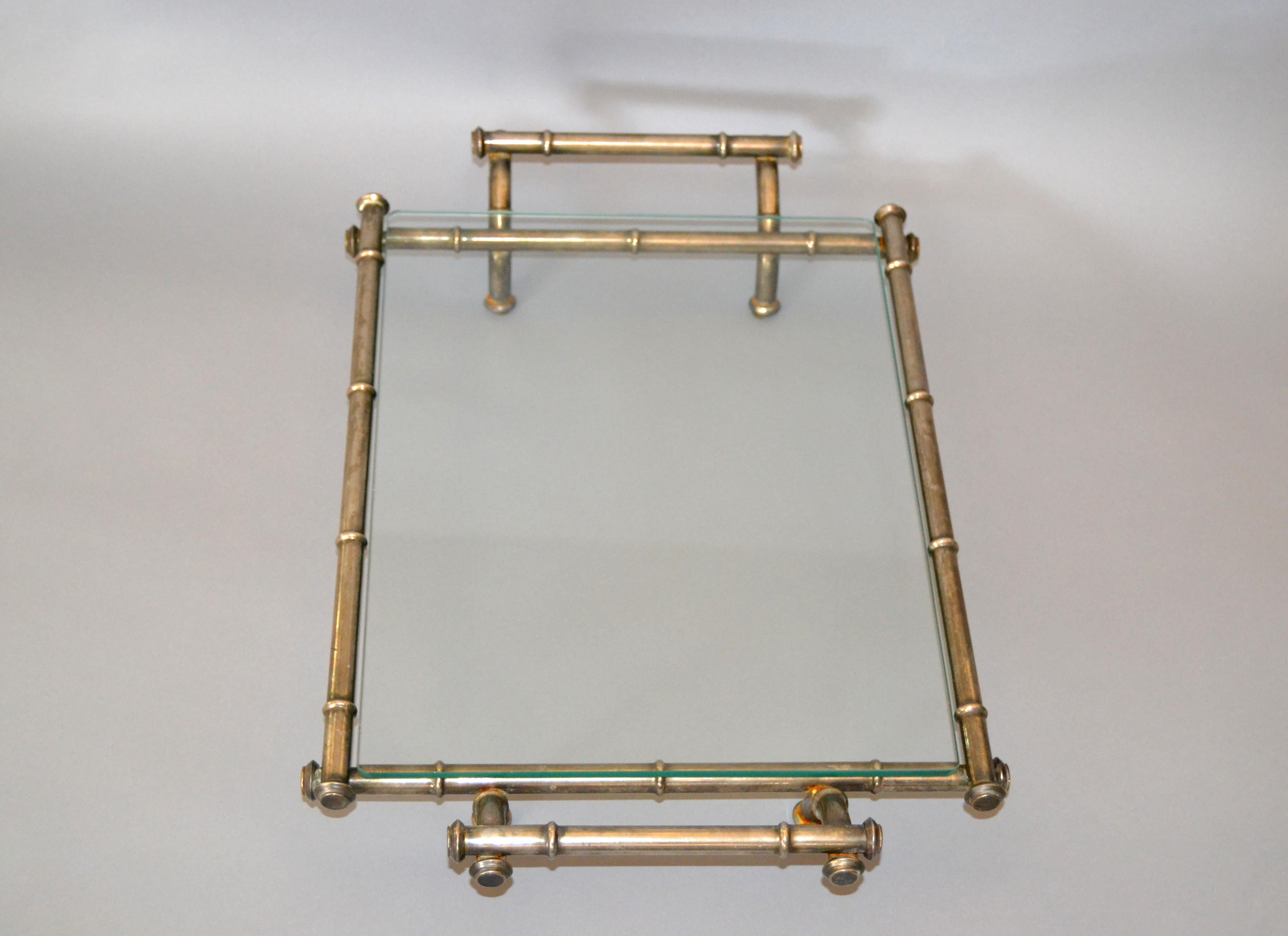 Hollywood Regency faux bamboo metal and glass table tray, serving tray, platter.
Easy to carry around and useful to serve your favourite snacks or for display.