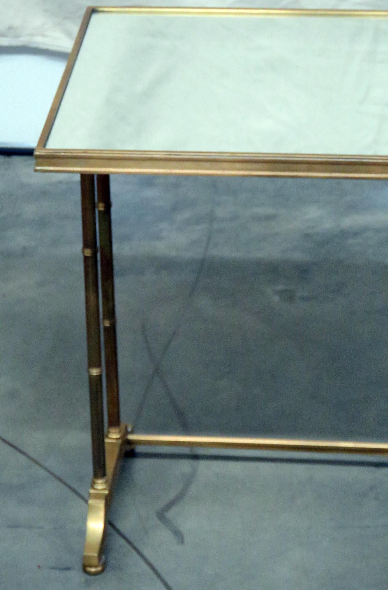 Hollywood Regency brass mirrored top side table.