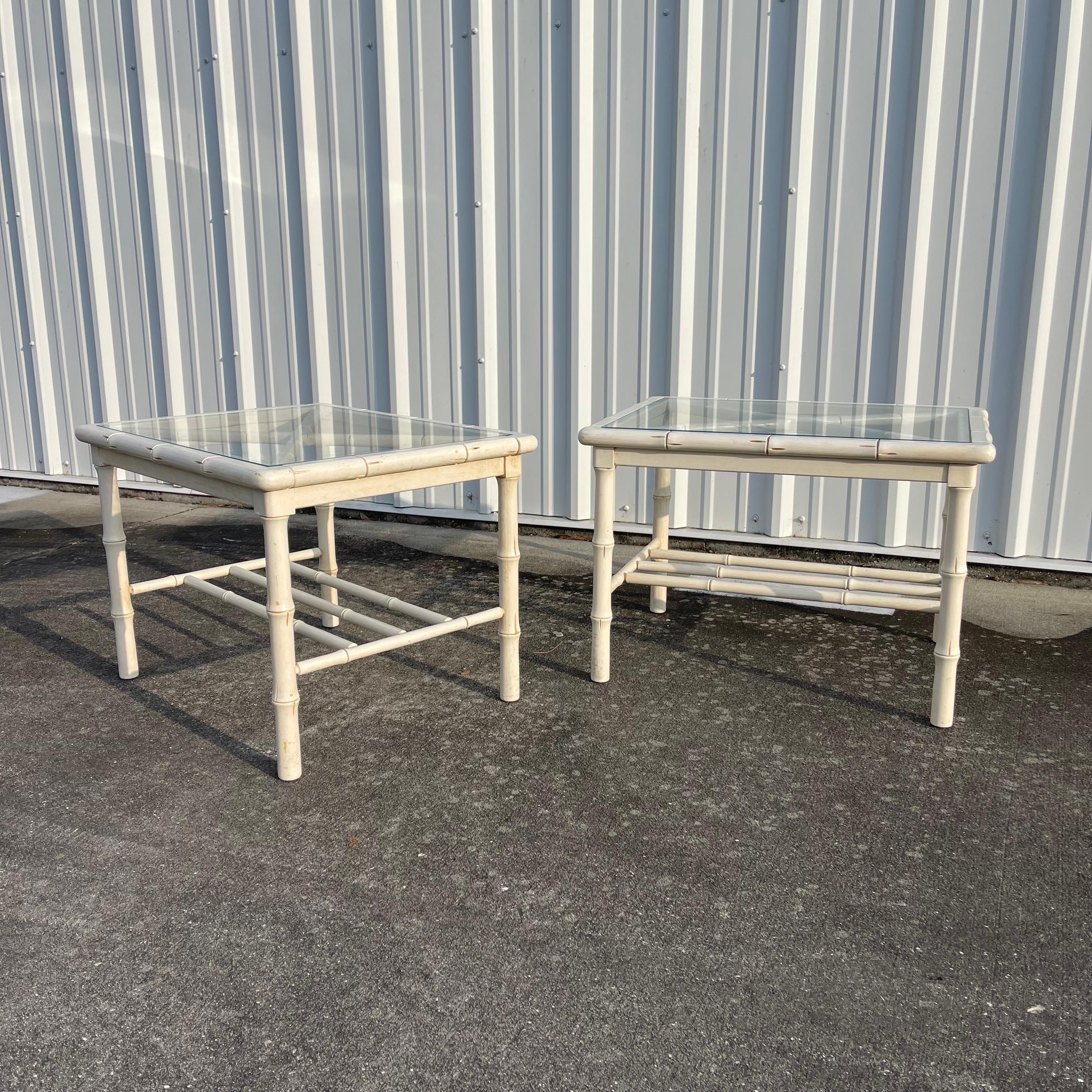 Fabulous vintage carved wood faux bamboo tables. Can be used as a pair of side tables but also works as a modular coffee table—put them together for increased surface area or separate them as you please.