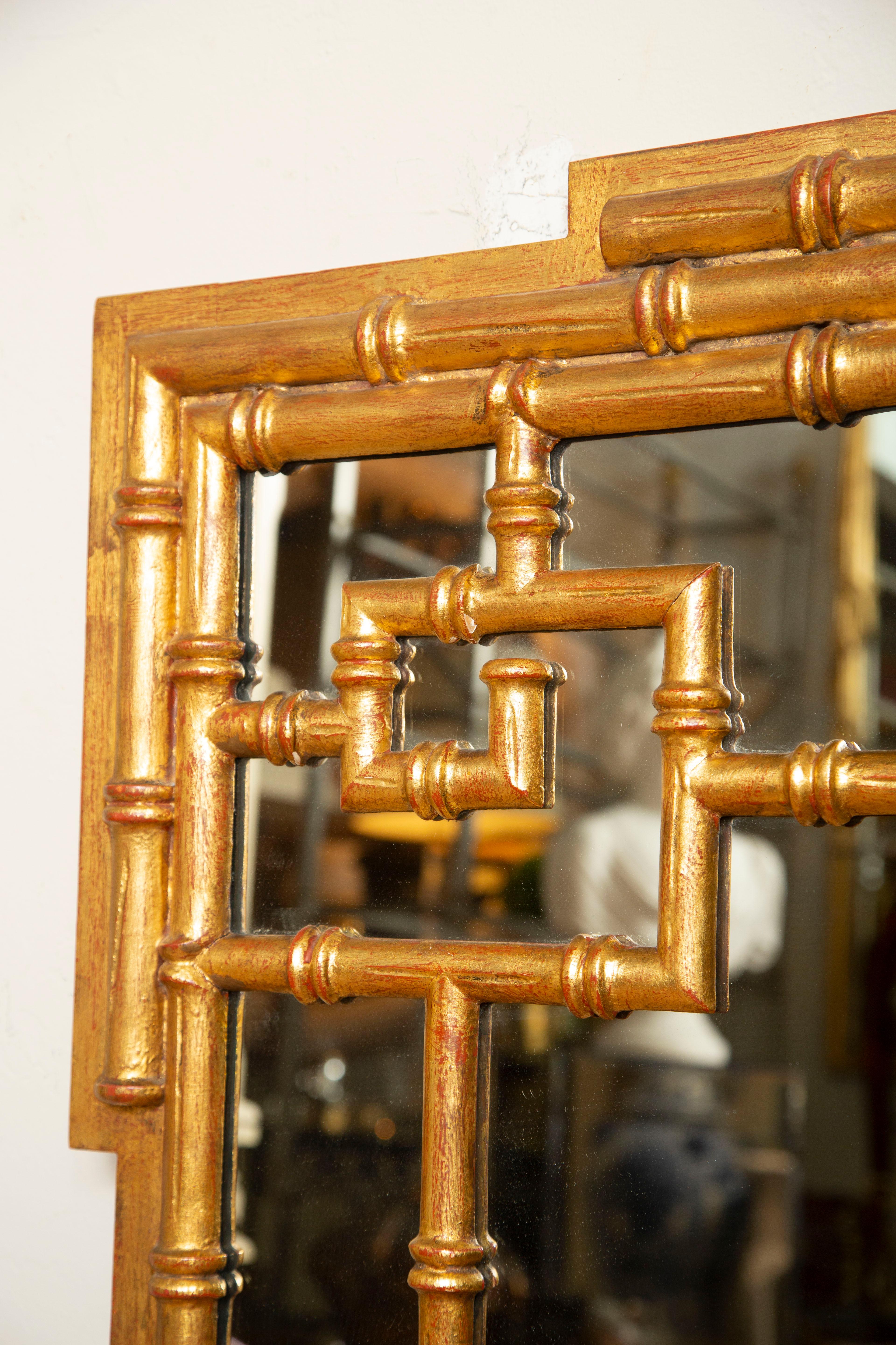 Faux bamboo chinoiserie style gilded mirror made in Italy.