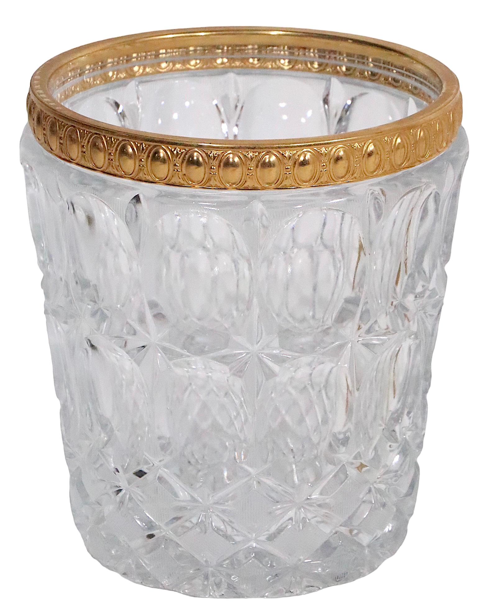 Probably the most glamorous champagne bucket , or wine cooler,  we have had the pleasure of offering. This voguish piece features a cast glass bucket with decorative brass trim, in faux gold gilt finish, which sets in a footed brass stand, also in