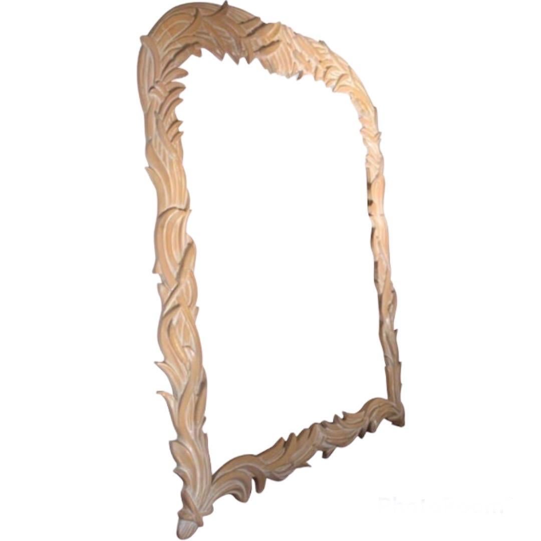 Massive foliate full-length mirror, in a carved wood with a cerused finish.

Based on the work of Serge Roche, though the maker of this piece is not known.