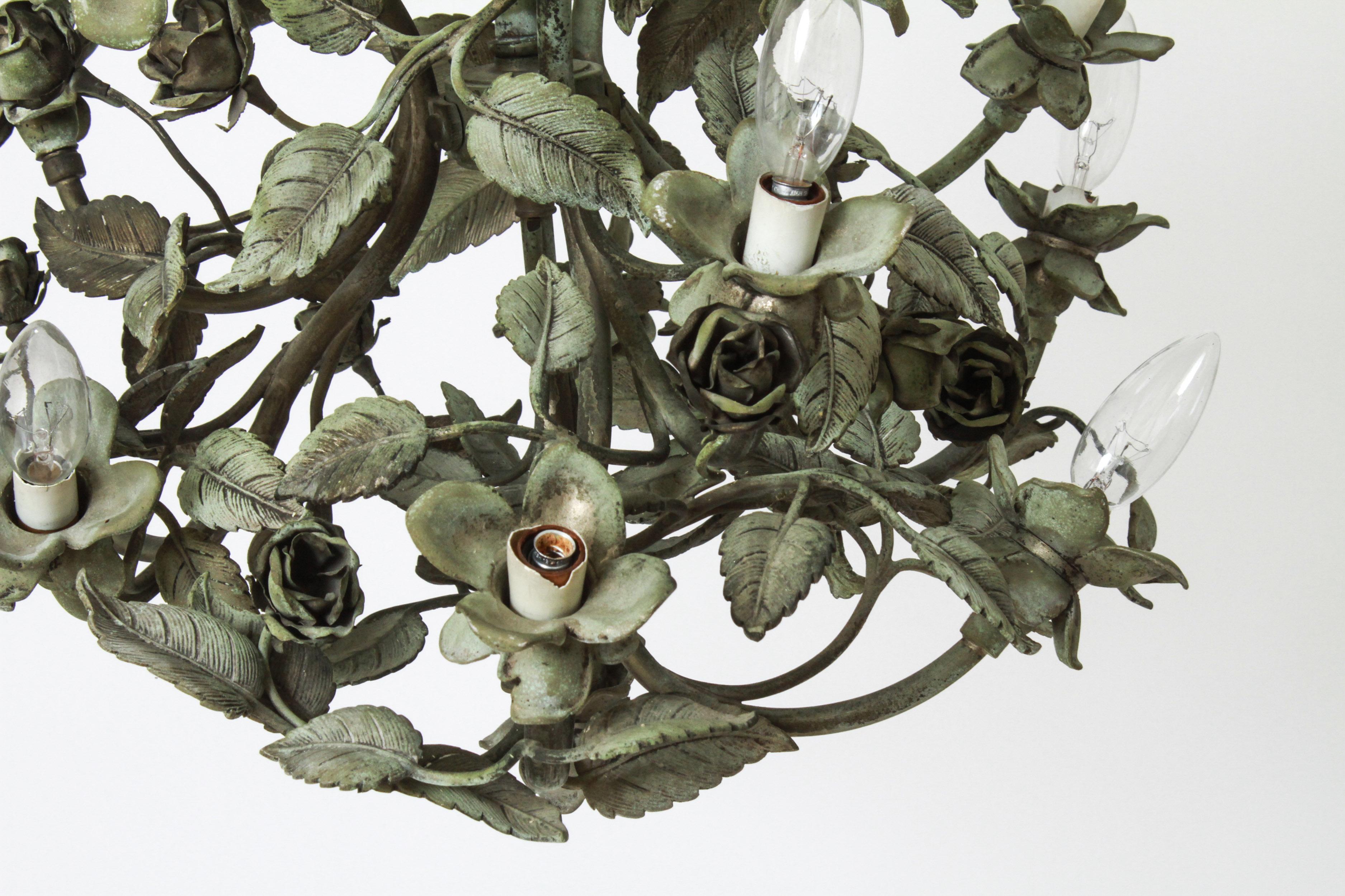 Hollywood Regency twelve-light patinated bronze foliate form chandelier. 25