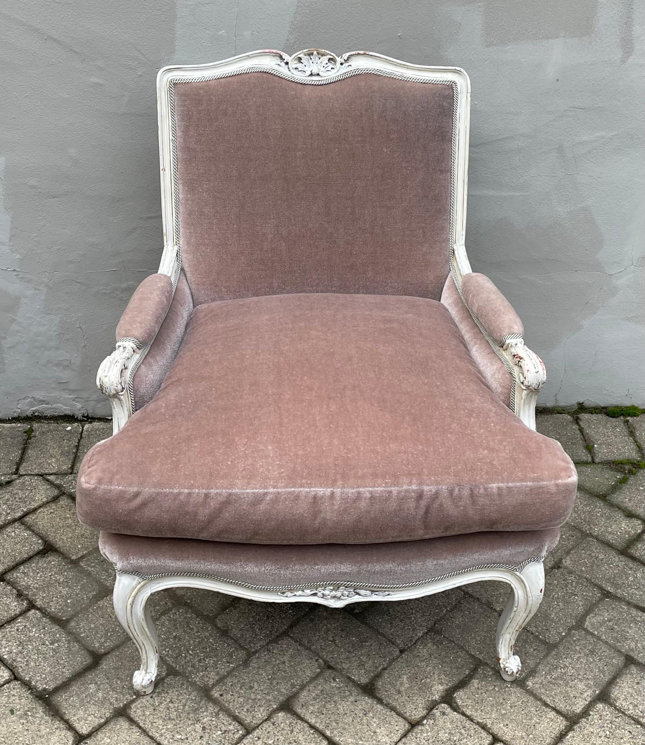 Well appointed Hollywood Regency French Bergere side chair with antiqued white frame finished in light plum velvet mohair, 1950's.